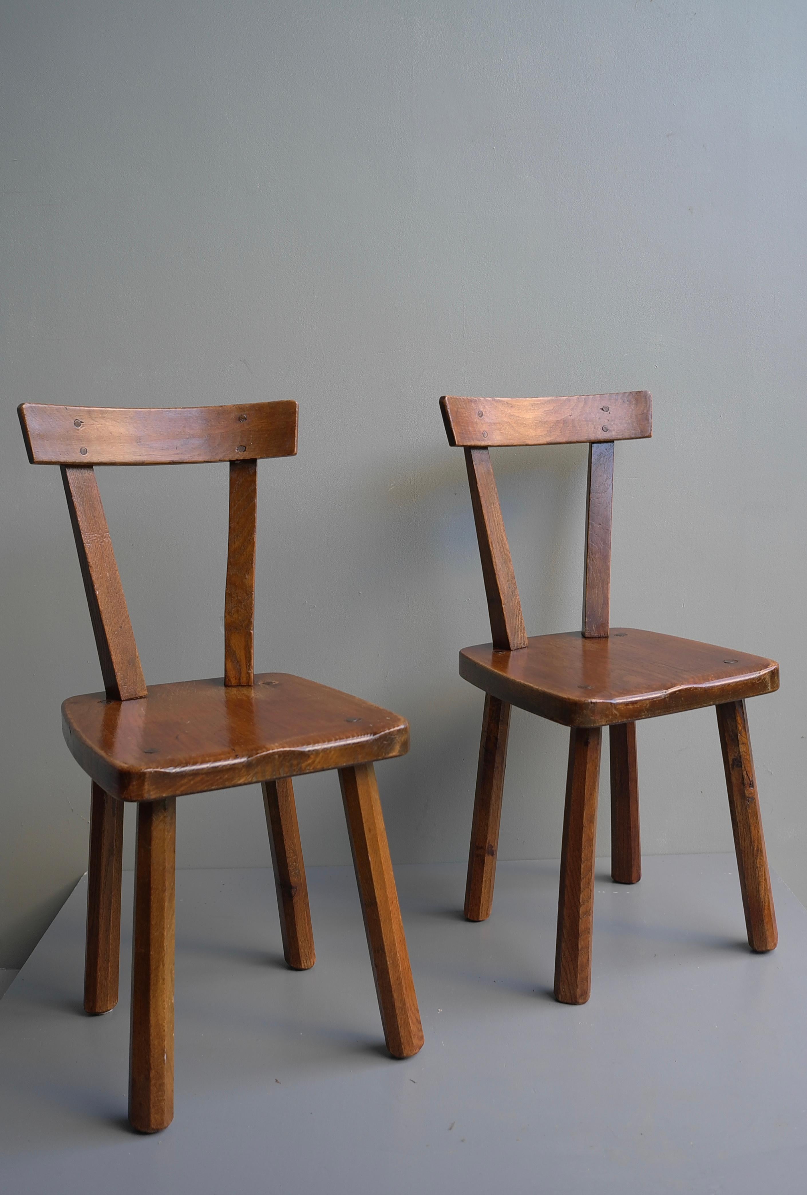 Pair of oak chairs in style of Axel Einar Hjorth, Sweden 1950's.