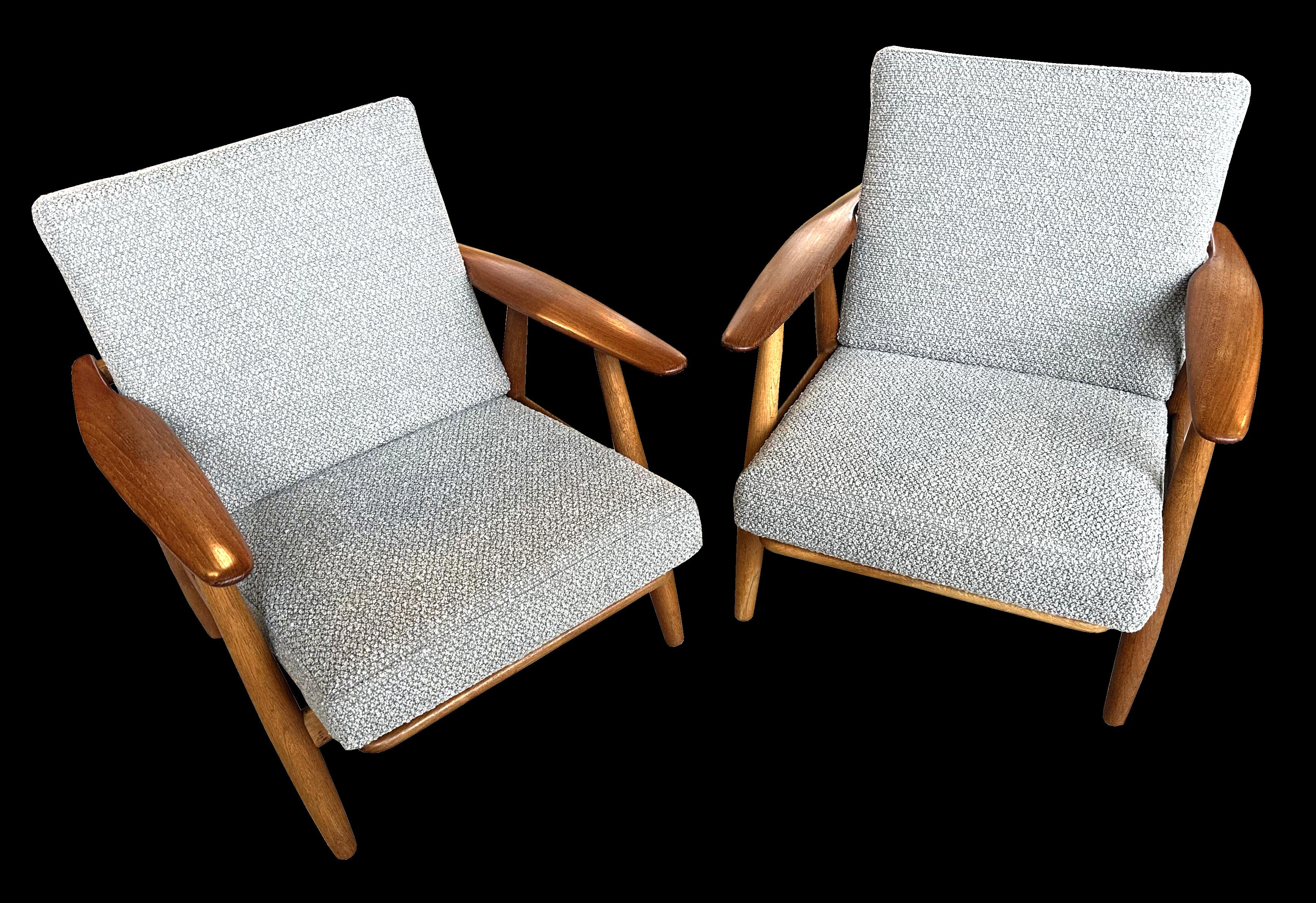 These are a particularly good original pair of Wegner Cigar chairs, all original apart from the covers on the cushions, which retain the original interiors, so feel as they should to sit in, with grey Boucle fabric covers.