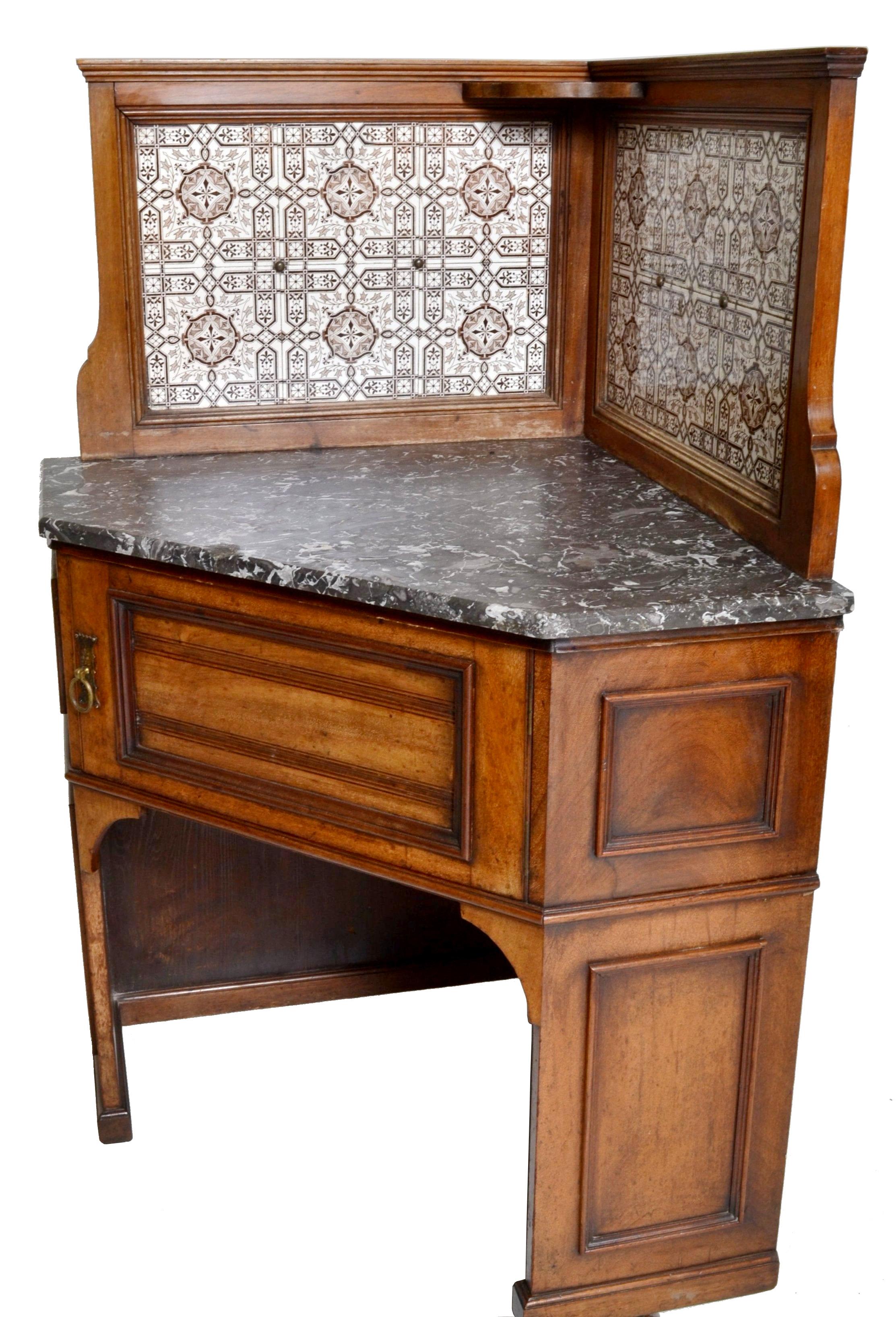 19th century pair of oak corner washstands by Maple of London, in the Aesthetic Movement taste, with Minton's tiles, circa 1875. The galleried splashbacks inlaid with Minton's tiles, each washstand having a variegated marble top. Each having the