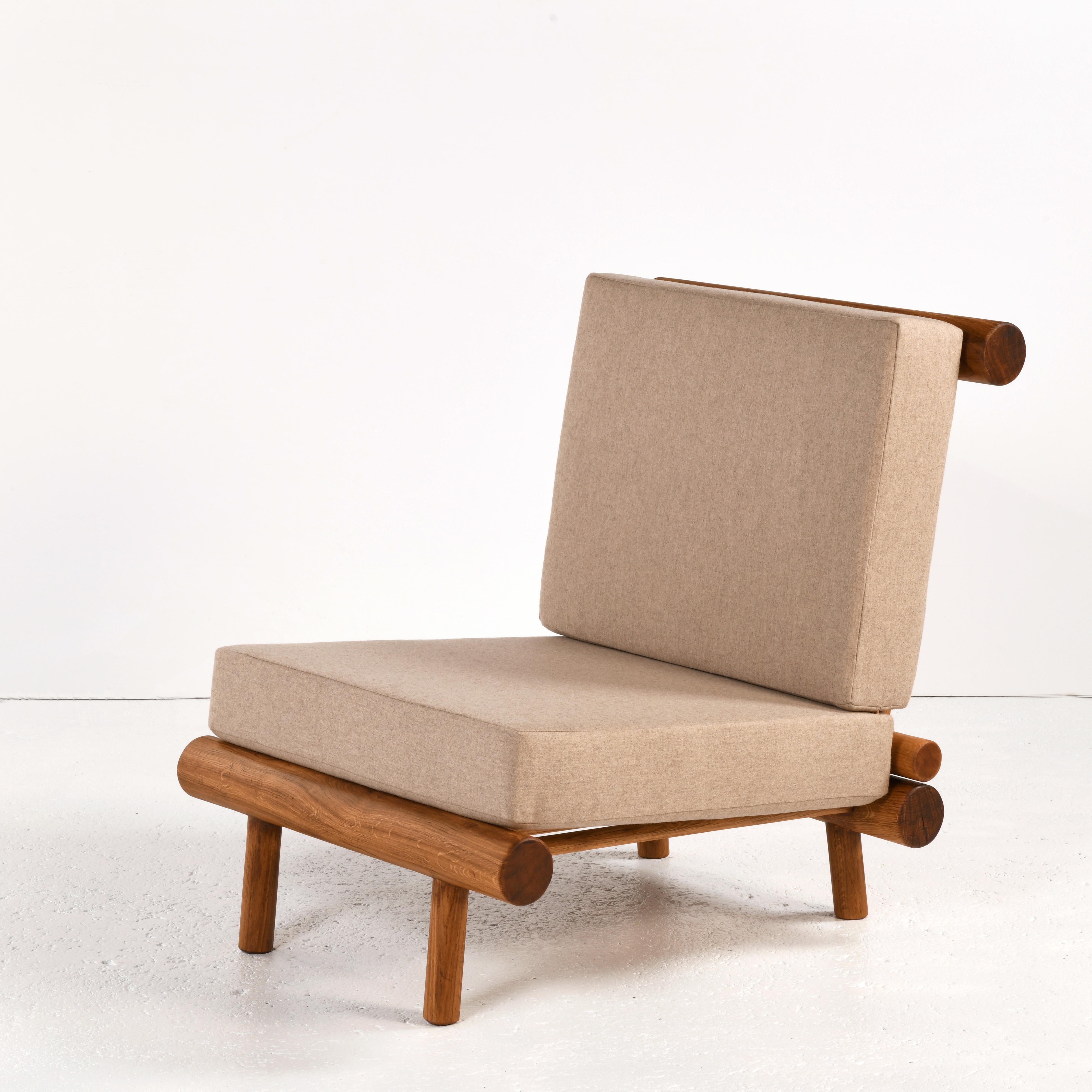 Pair of oak fireside chairs called La cachette, attributed to Charlotte Perriand 3