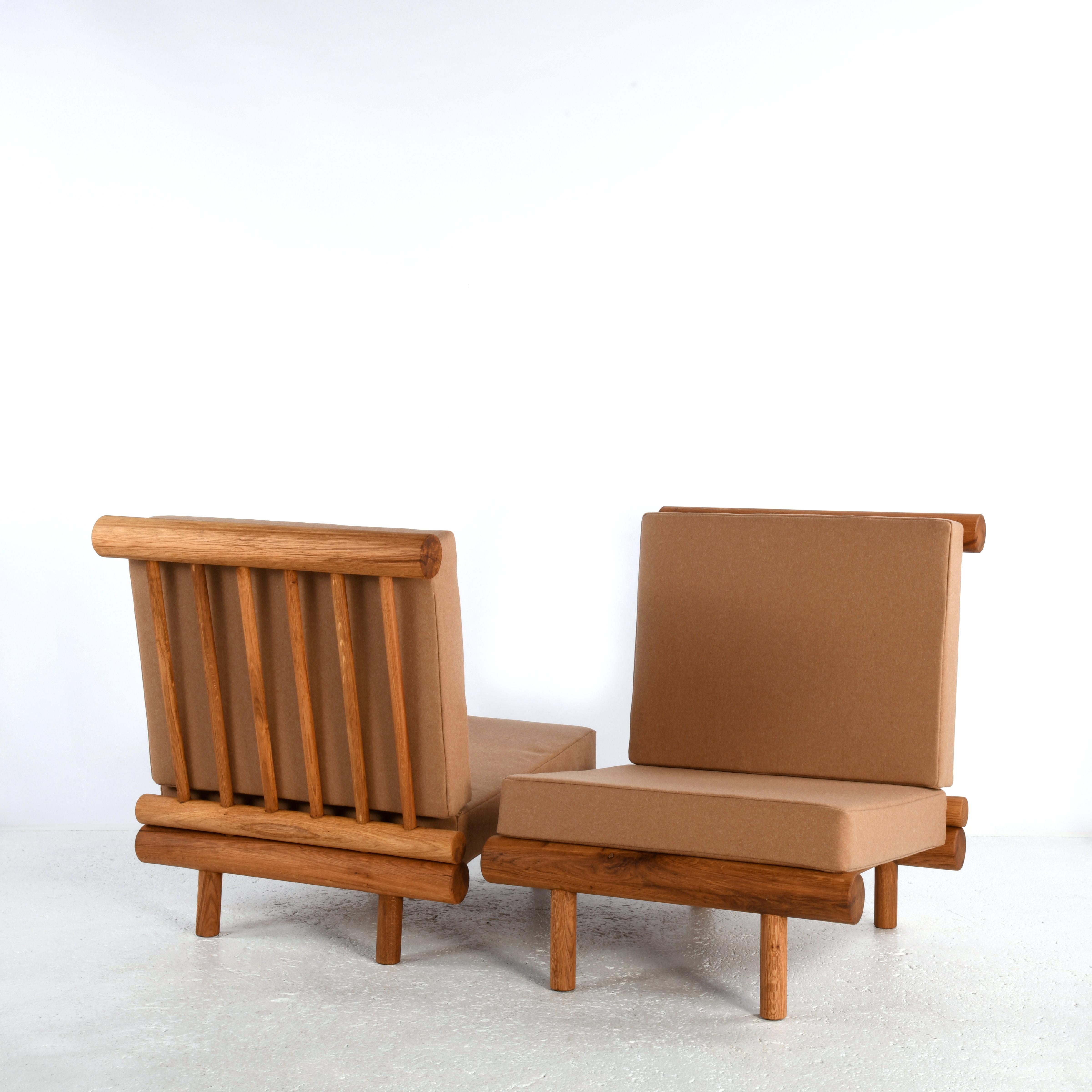 Mid-Century Modern Pair of oak fireside chairs called La cachette, attributed to Charlotte Perriand