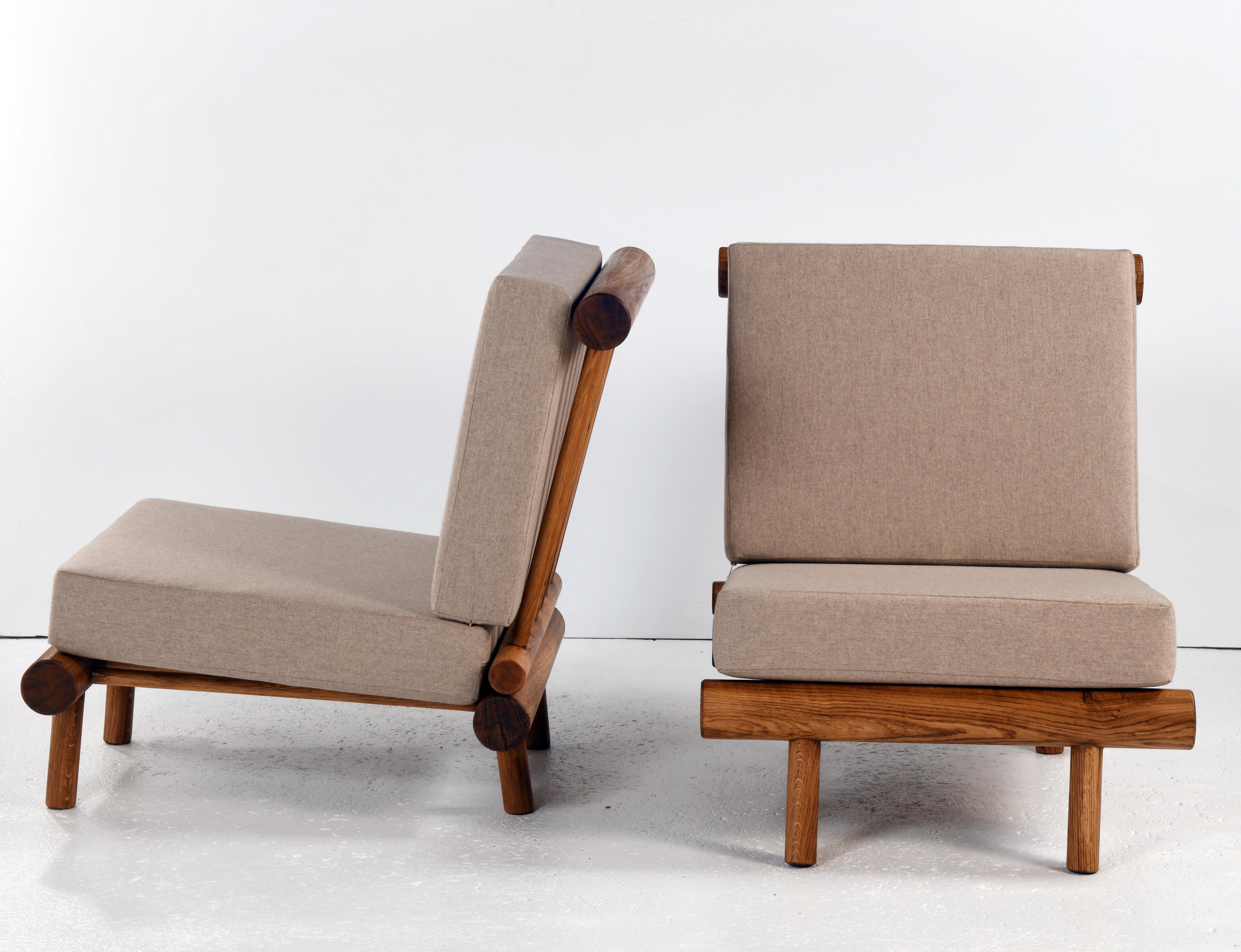 Wool Pair of oak fireside chairs called La cachette, attributed to Charlotte Perriand