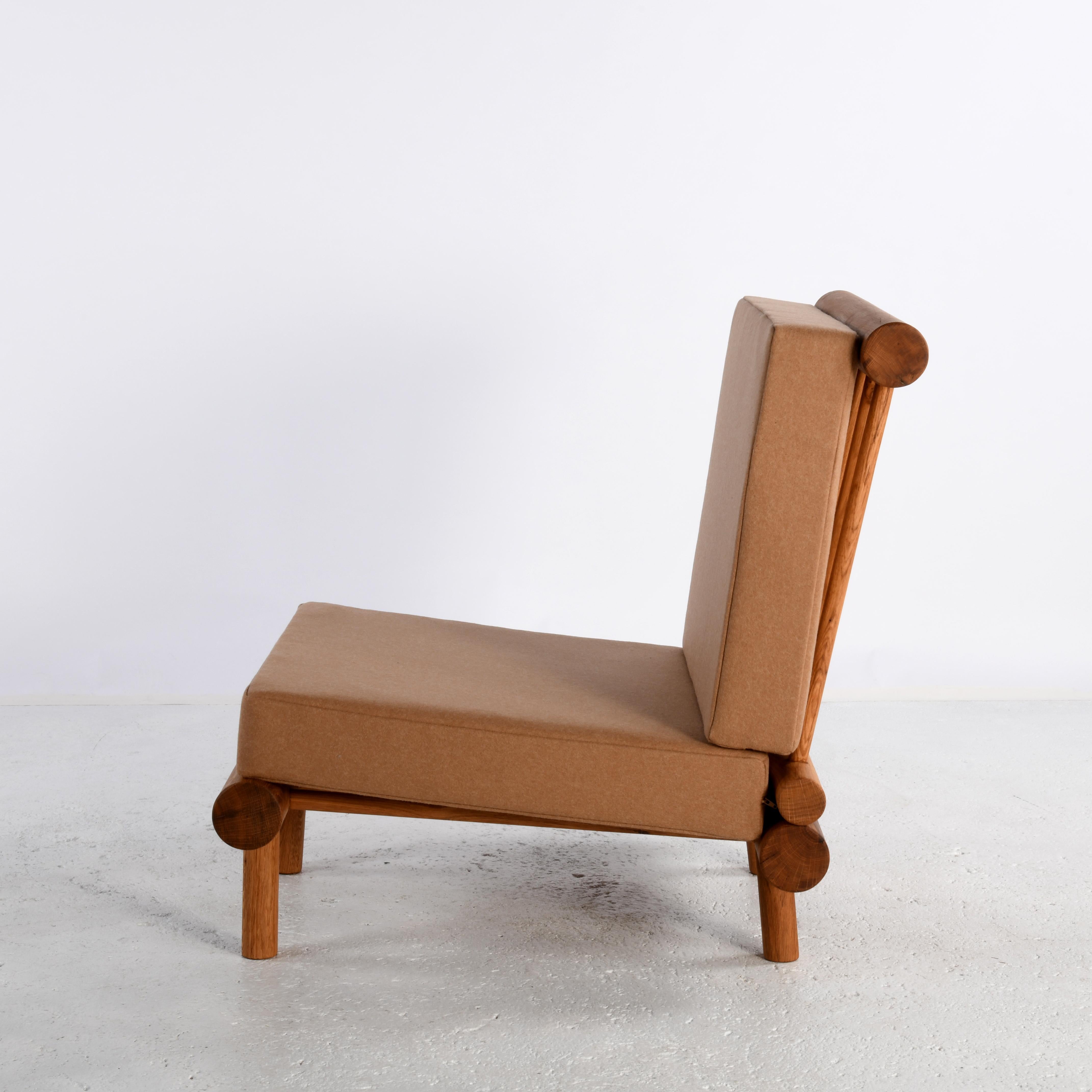 Pair of oak fireside chairs called La cachette, attributed to Charlotte Perriand 1