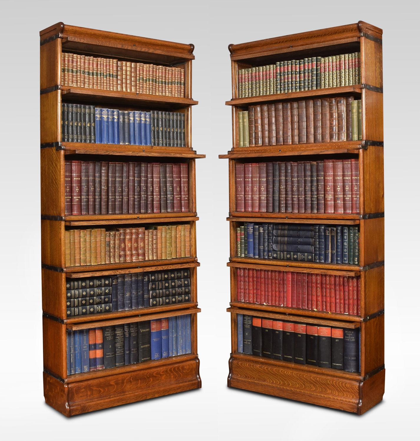 Pair of oak Globe Wernicke bookcases, the moulded top above six sections all having glazed doors. Raised up on plinth base.
Dimensions
Height 81 inches
Width 34 inches
Depth 12.5 inches.