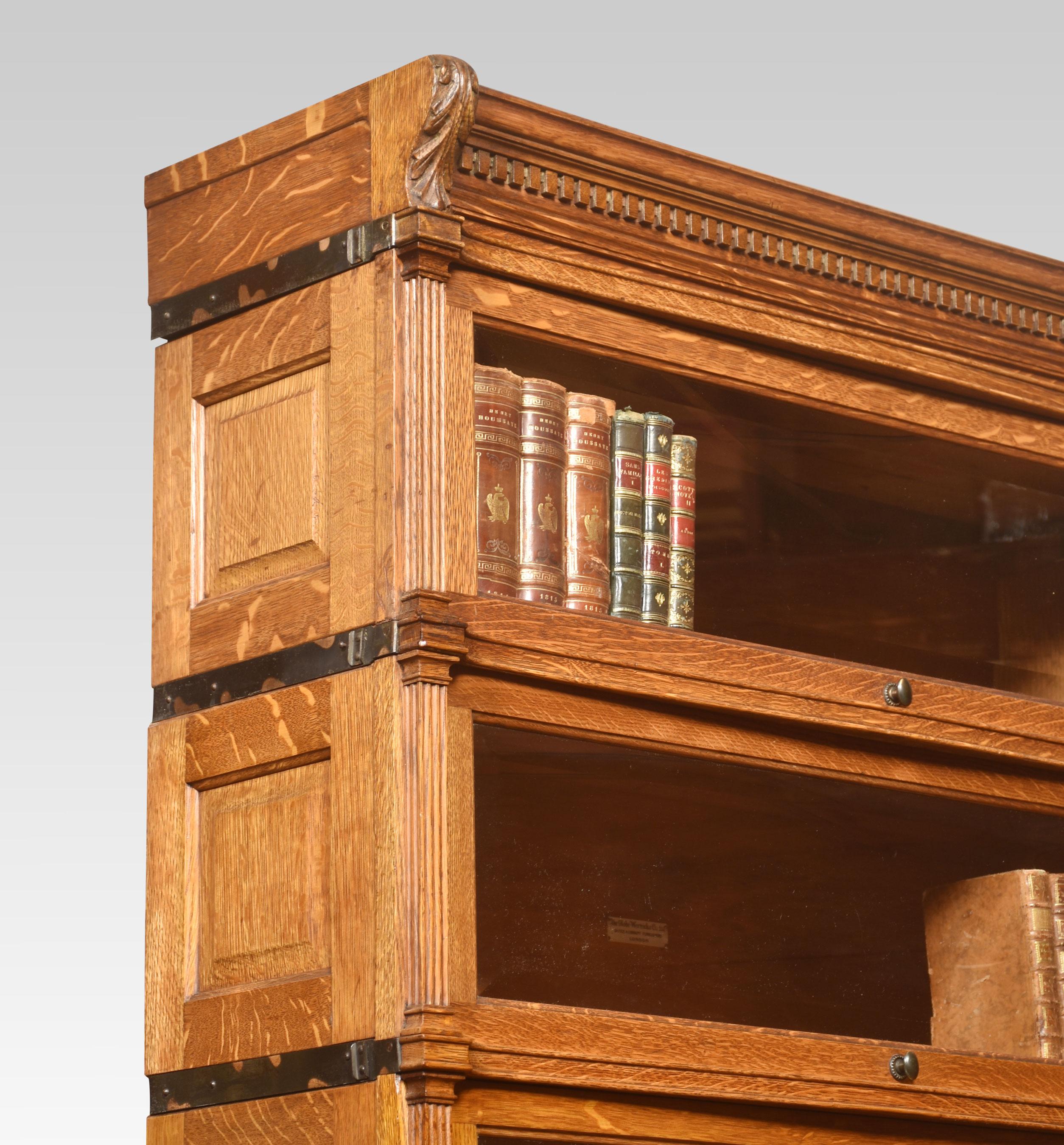 Pair of oak Globe Wernicke sectional bookcase, having six tiers with beveled glazed doors, between fluted pilasters and having paneled sides, raised on a plinth base with single long drawer.
Dimensions
Height 84.5 Inches
Width 35.5 Inches
Depth