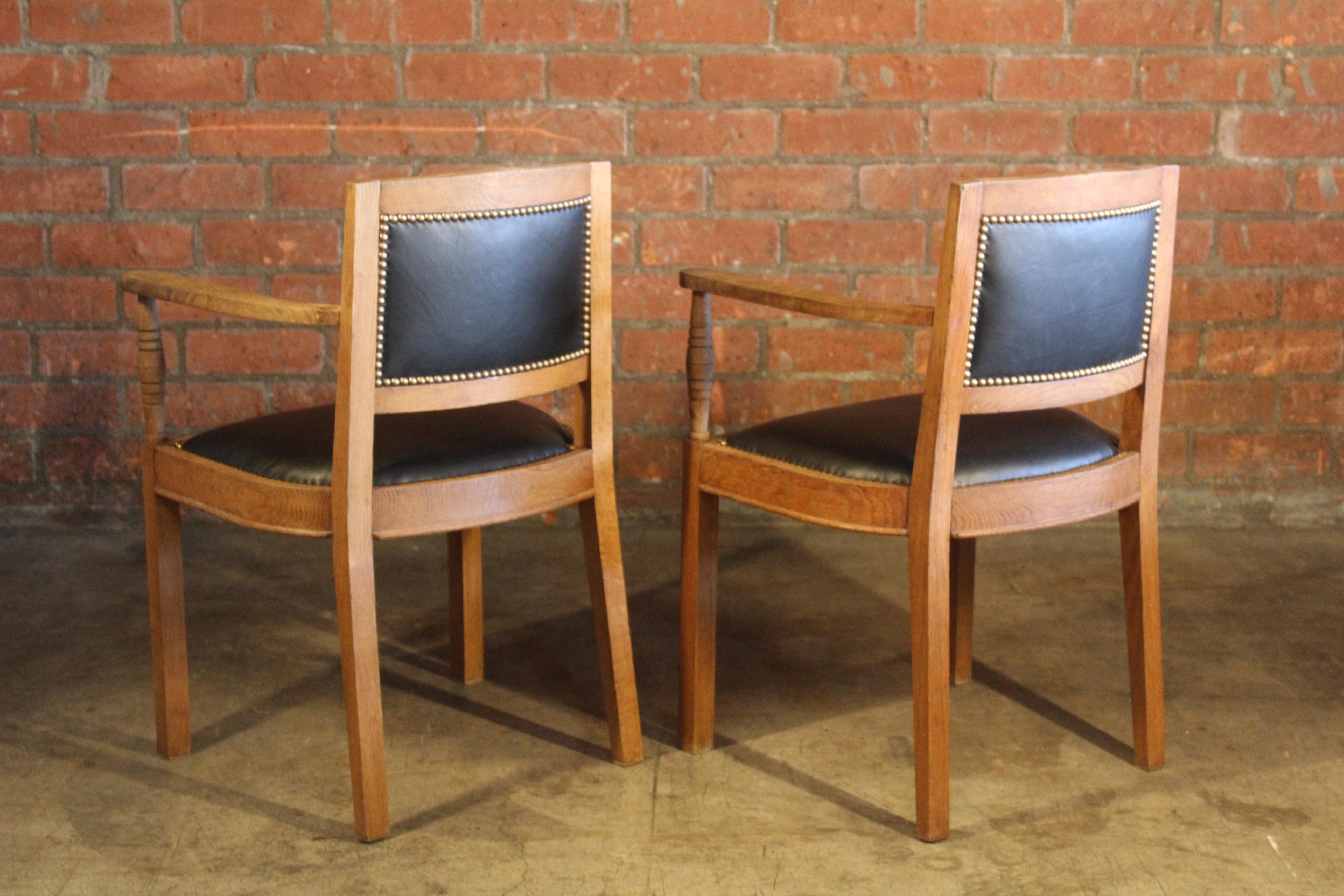 Brass Pair of Oak & Leather Armchairs Attributed to Charles Dudoyt, France, 1940s