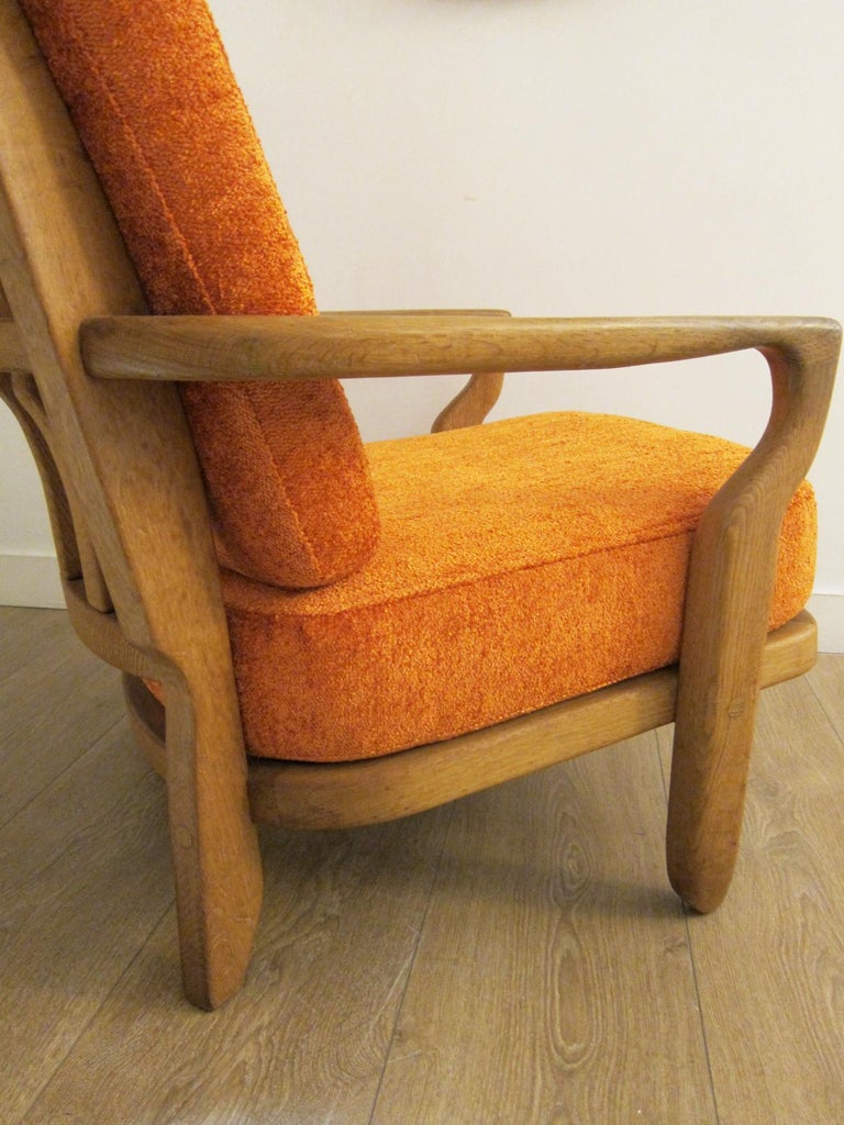 Pair of oak Lounge chairs by Guillerme et Chambron, France 1960
This model is a mid repos, model Juliette
Sculptural organic shape, finger back 
Retains a beautiful warm patina
These chairs are newly upholstered with an orange chenille with cream