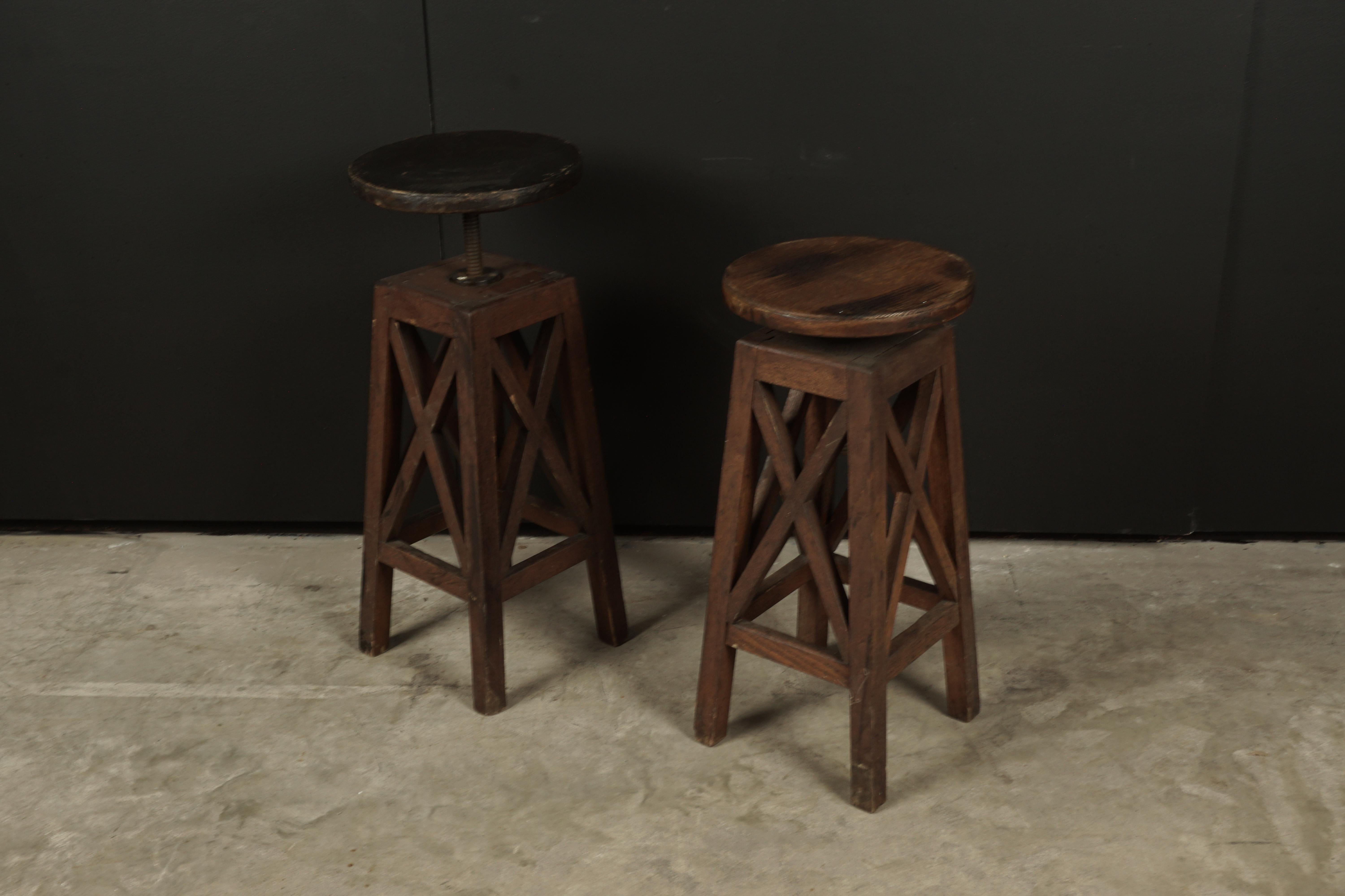 Vintage pair of oak pedestals from France, circa 1950. Solid oak construction with adjustable platform height. Light wear and patina.