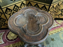 Pair of oak pedestals with clover motifs