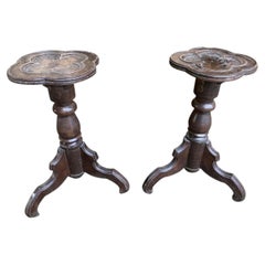Pair of oak pedestals with clover motifs
