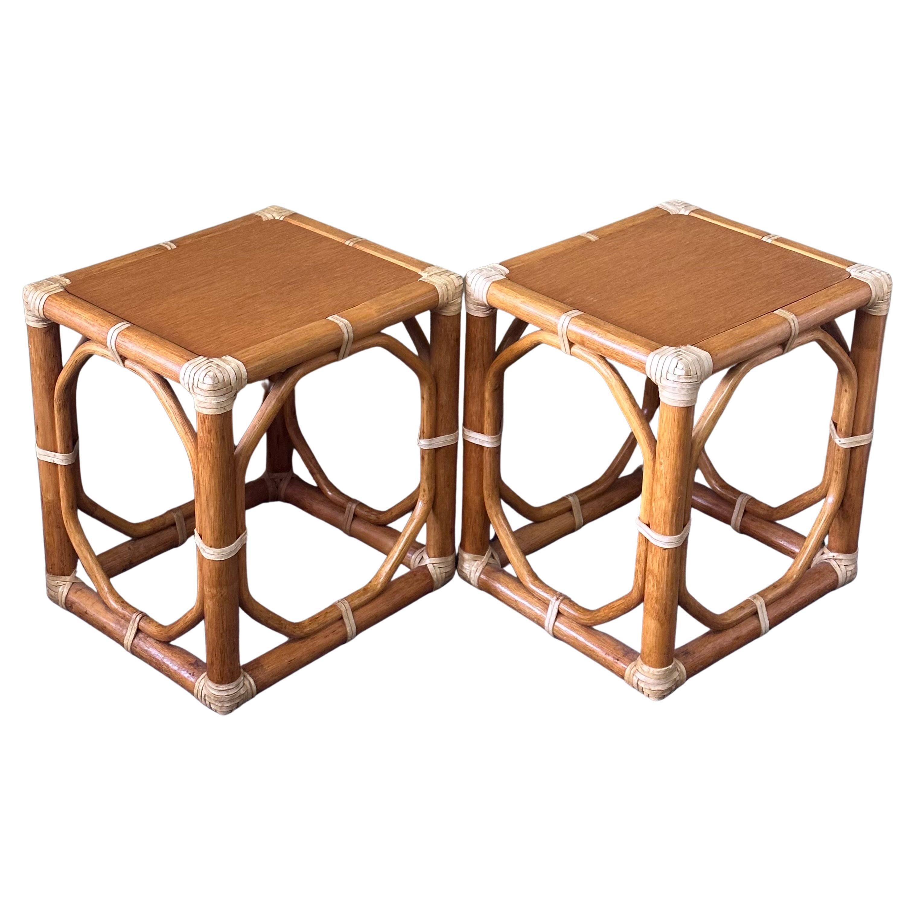A nice pair of oak and rattan side tables / stools by McGuire Furniture Co. of San Francisco, circa 1970s. These tables are difficult to find and are in very good vintage condition. Each one measures 16