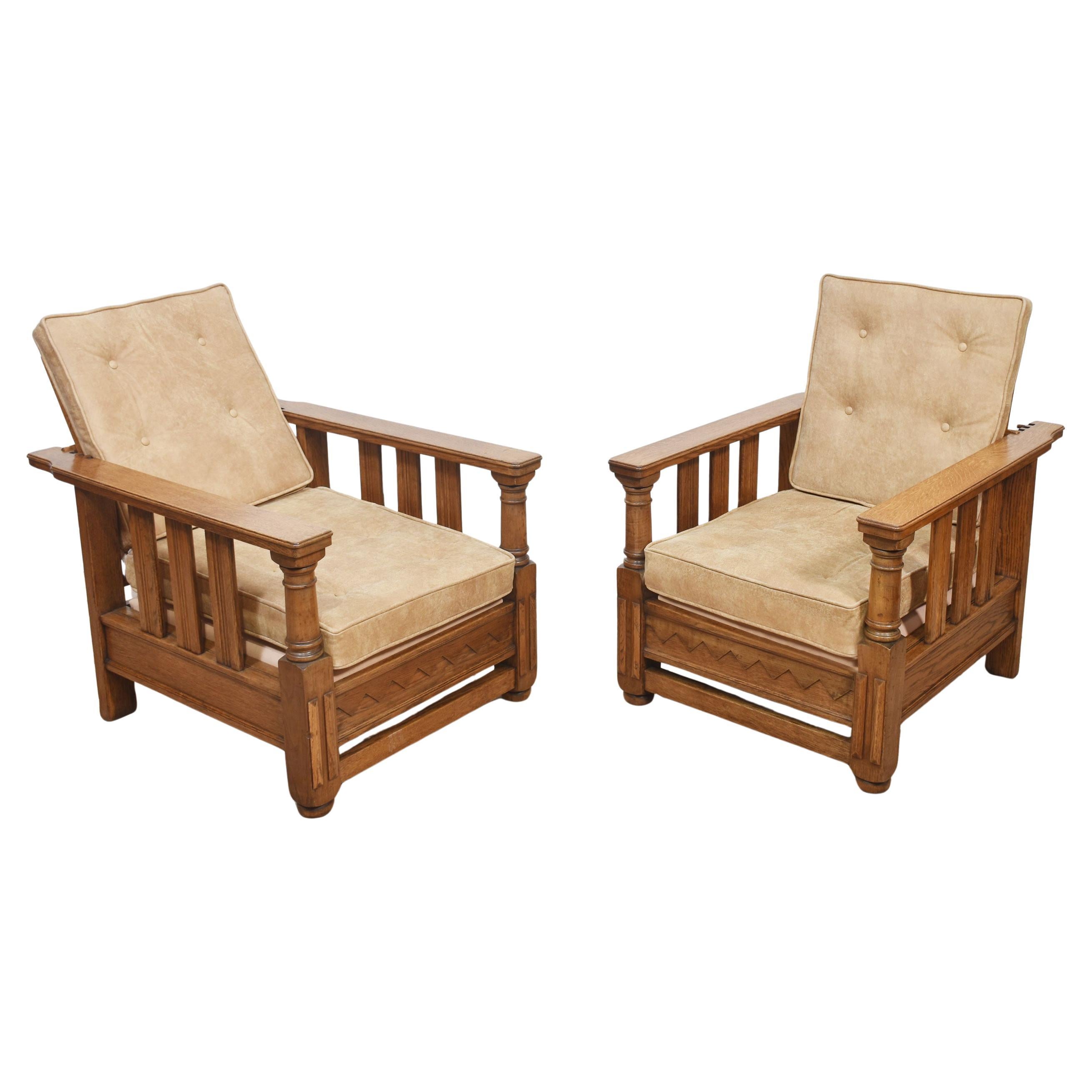 Pair of oak reclining armchairs