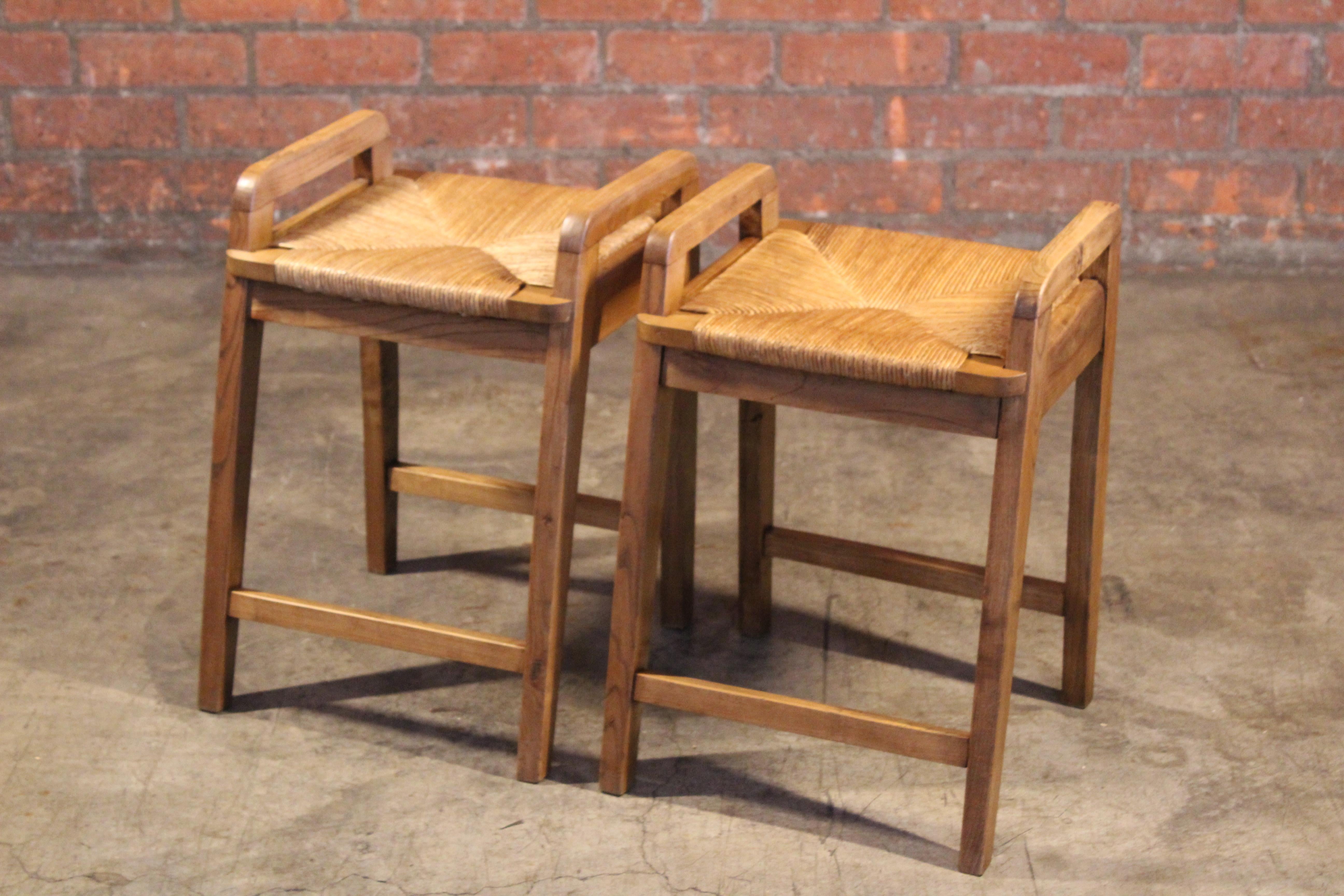 Pair of vintage oak stools with rush seats from France, 1950s. Sold as a pair, they are in excellent condition.