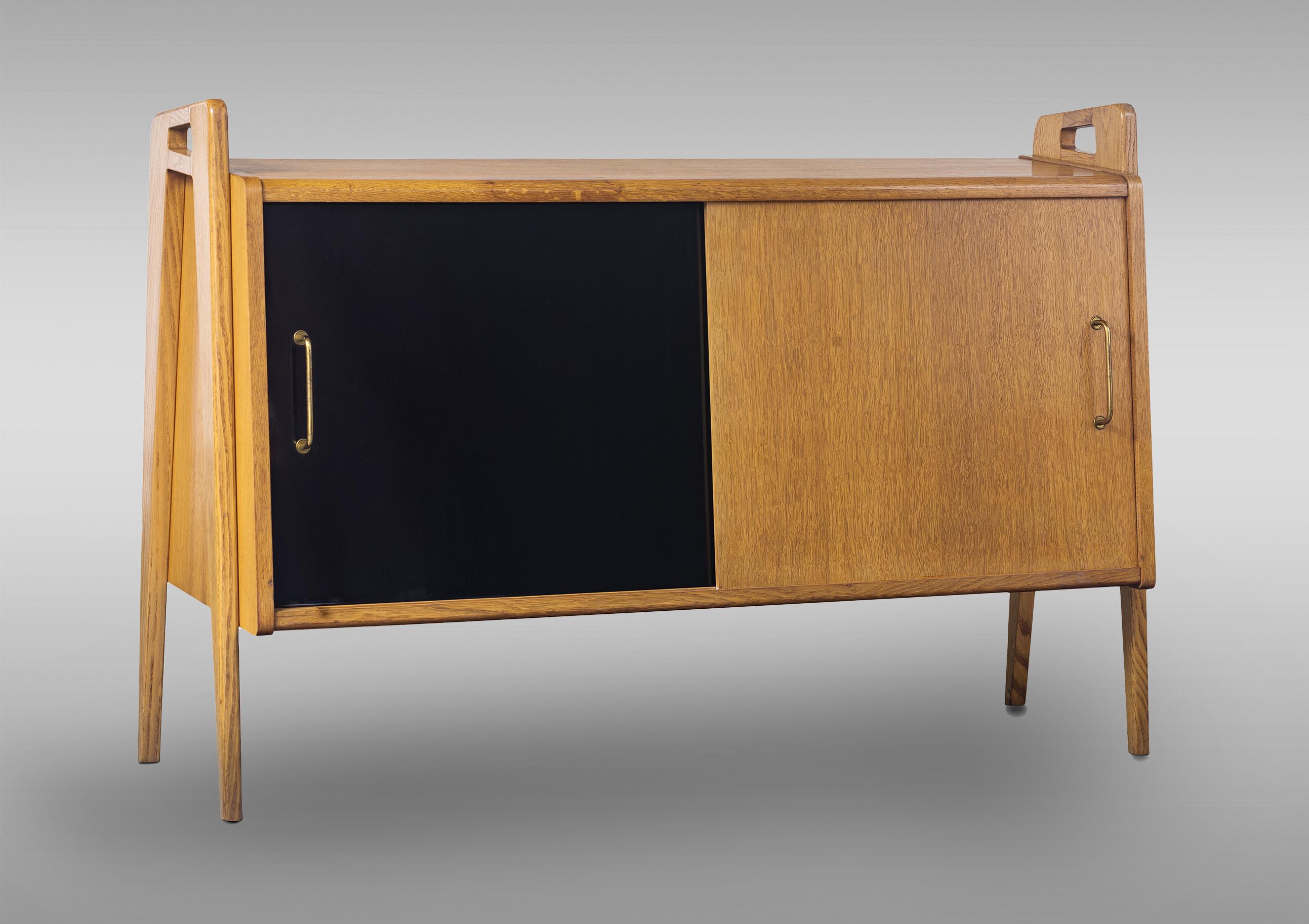 French Pair of oak sideboards with sloping front, sliding doors, one of them lacquered For Sale