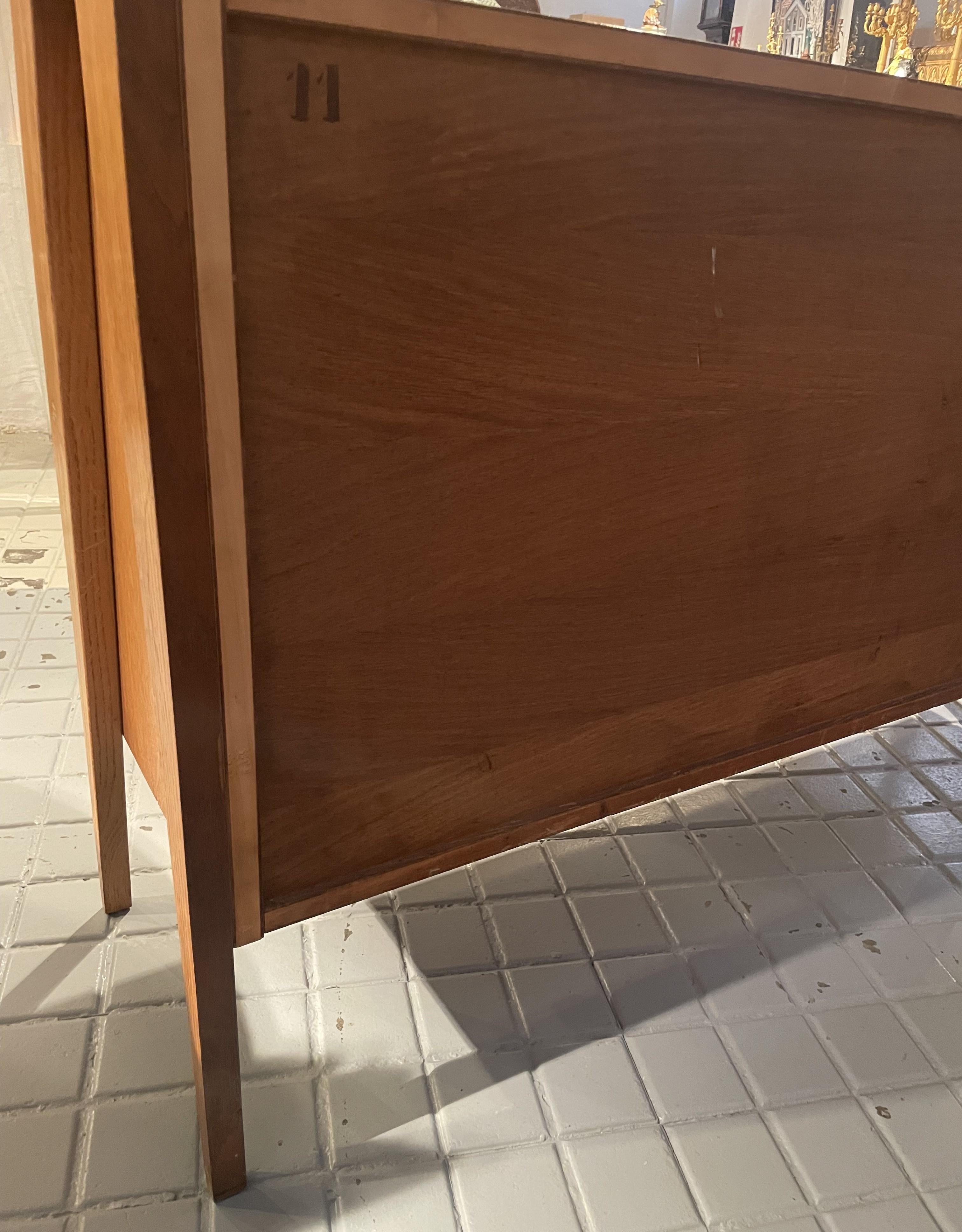 Pair of oak sideboards with sloping front, sliding doors, one of them lacquered For Sale 1
