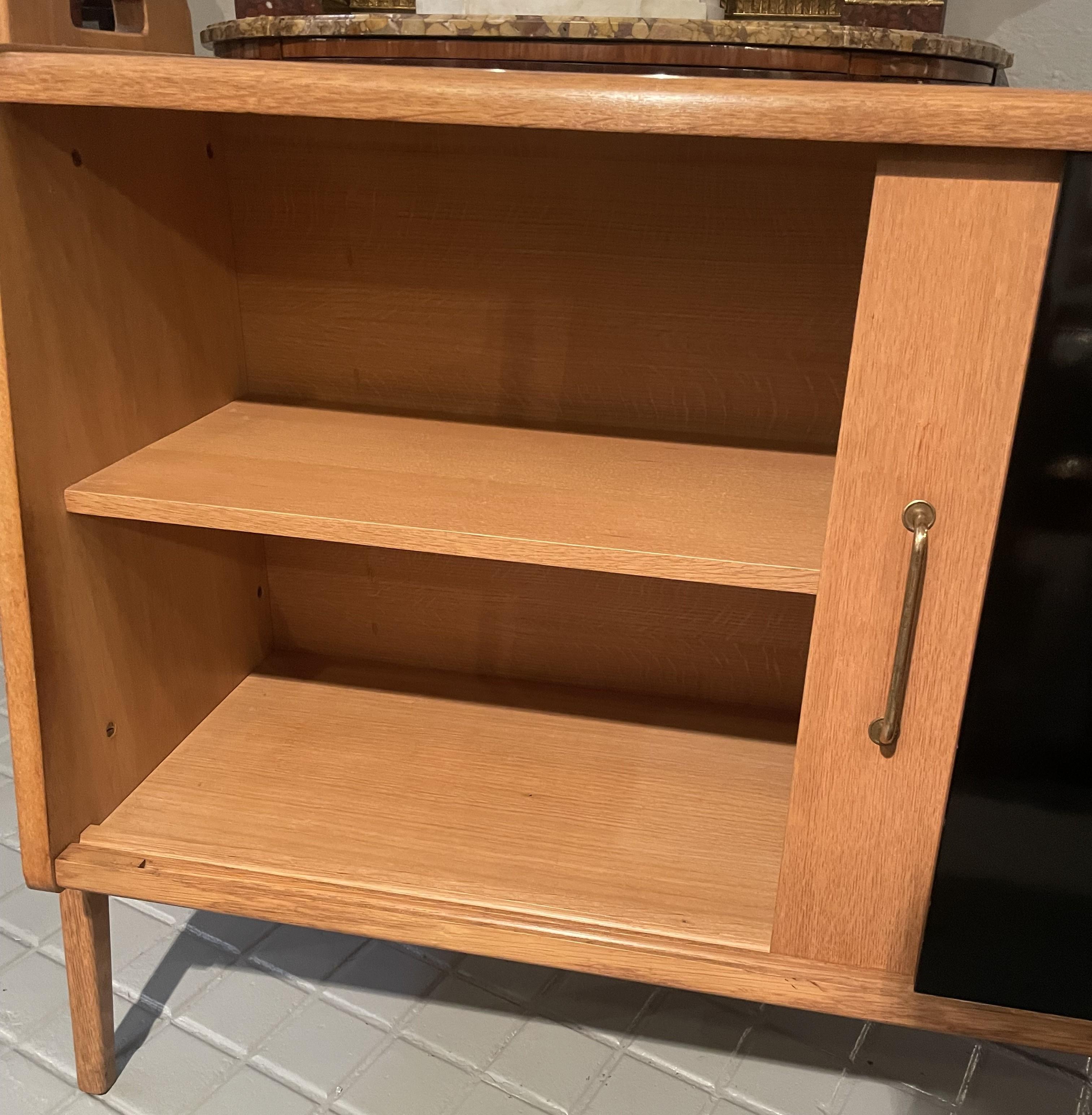 Pair of oak sideboards with sloping front, sliding doors, one of them lacquered For Sale 2