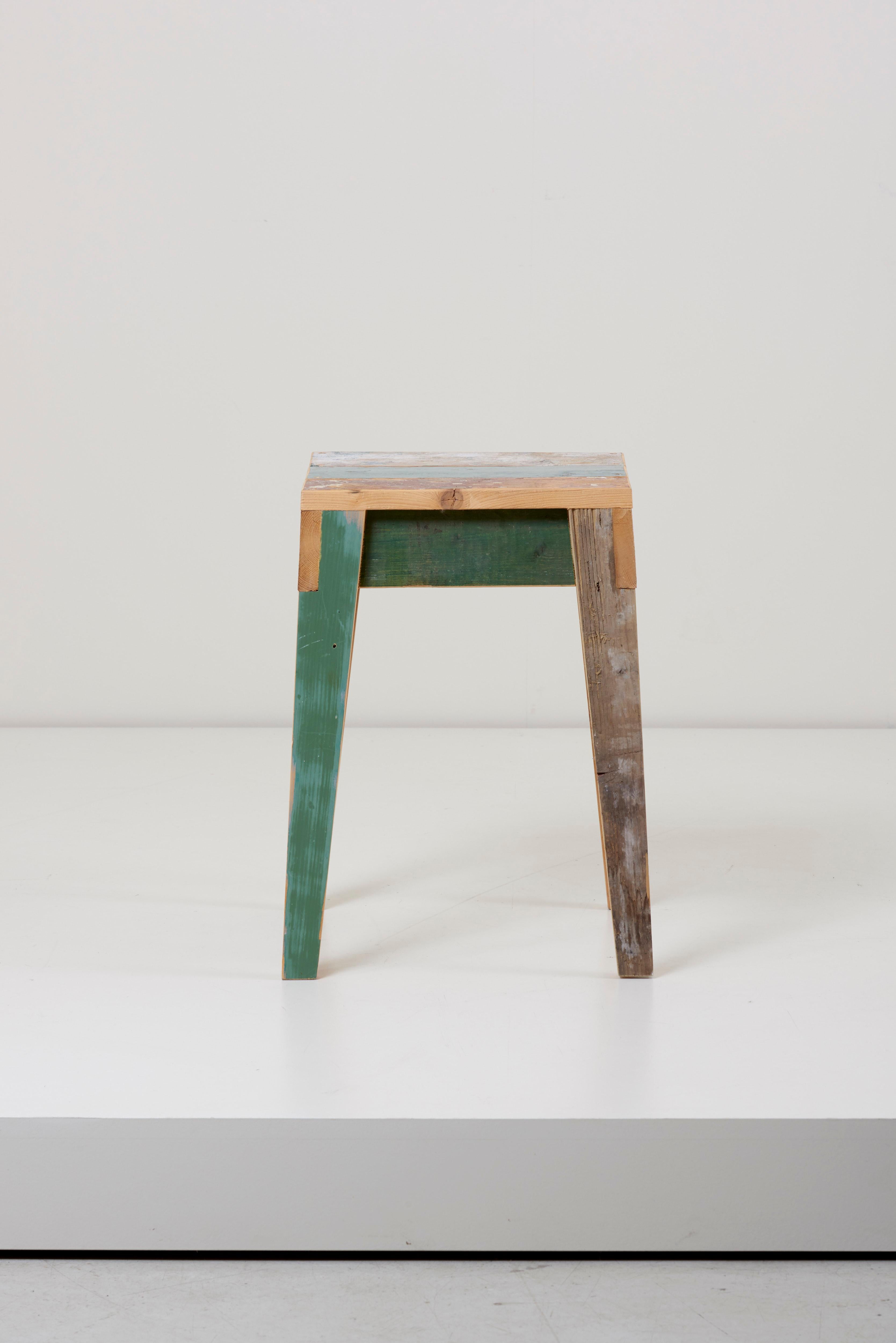 Two unique unvarnished stools made of reclaimed scrapwood in oak by Piet Hein Eek.