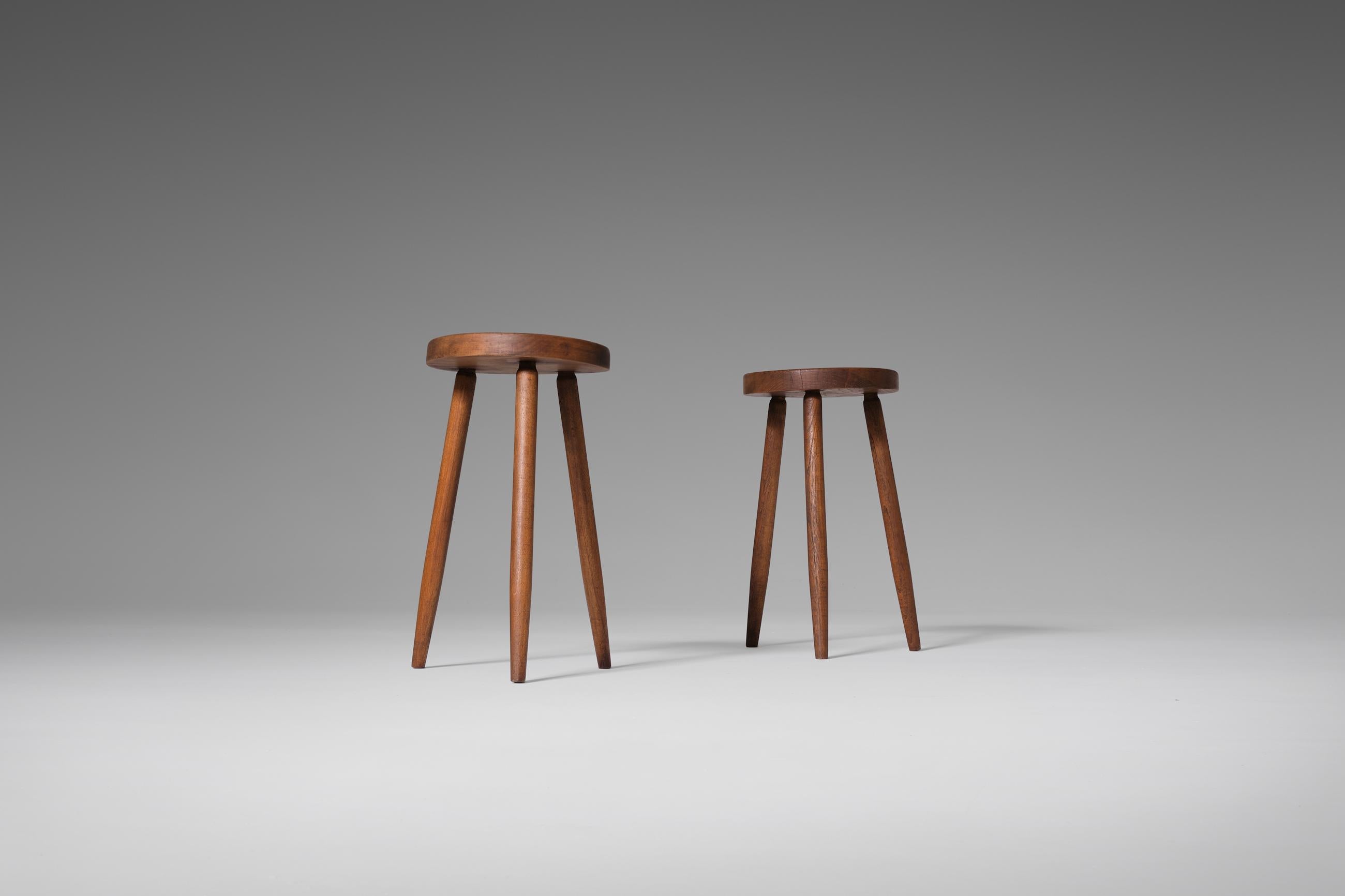 Pair of oak stools, 1960s. Elegant and refined pair made in solid oak. Characteristic for the stools are the nice subtle long thin tapered shaped legs. The solid oak shows a beautiful patina. In good original condition.