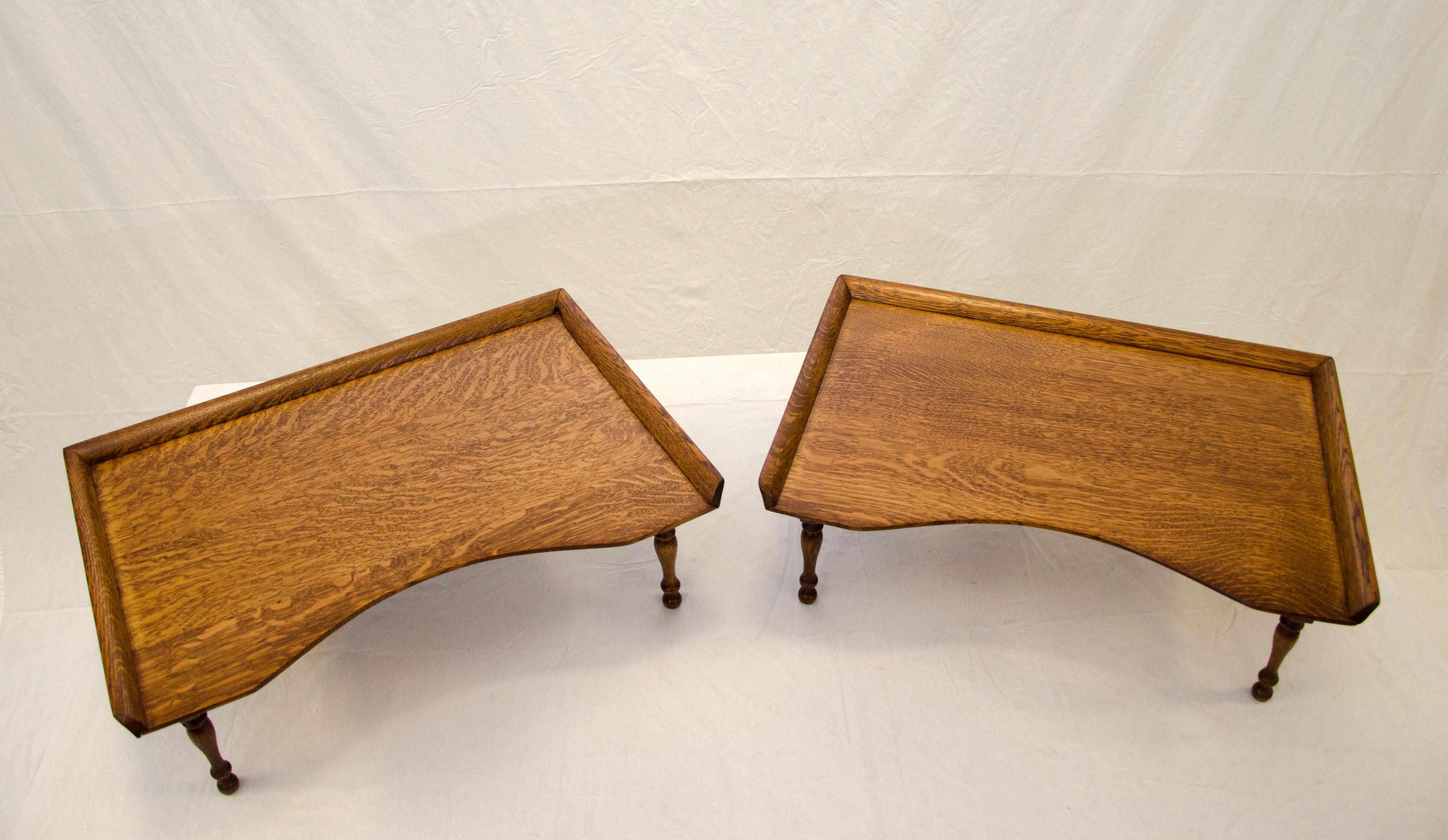 Pair of traditional style Victorian turn of the century bed trays or lap desks. The legs are collapsible for easy compact storage. The trays have a recessed edge at the front and a raised gallery around three sides.