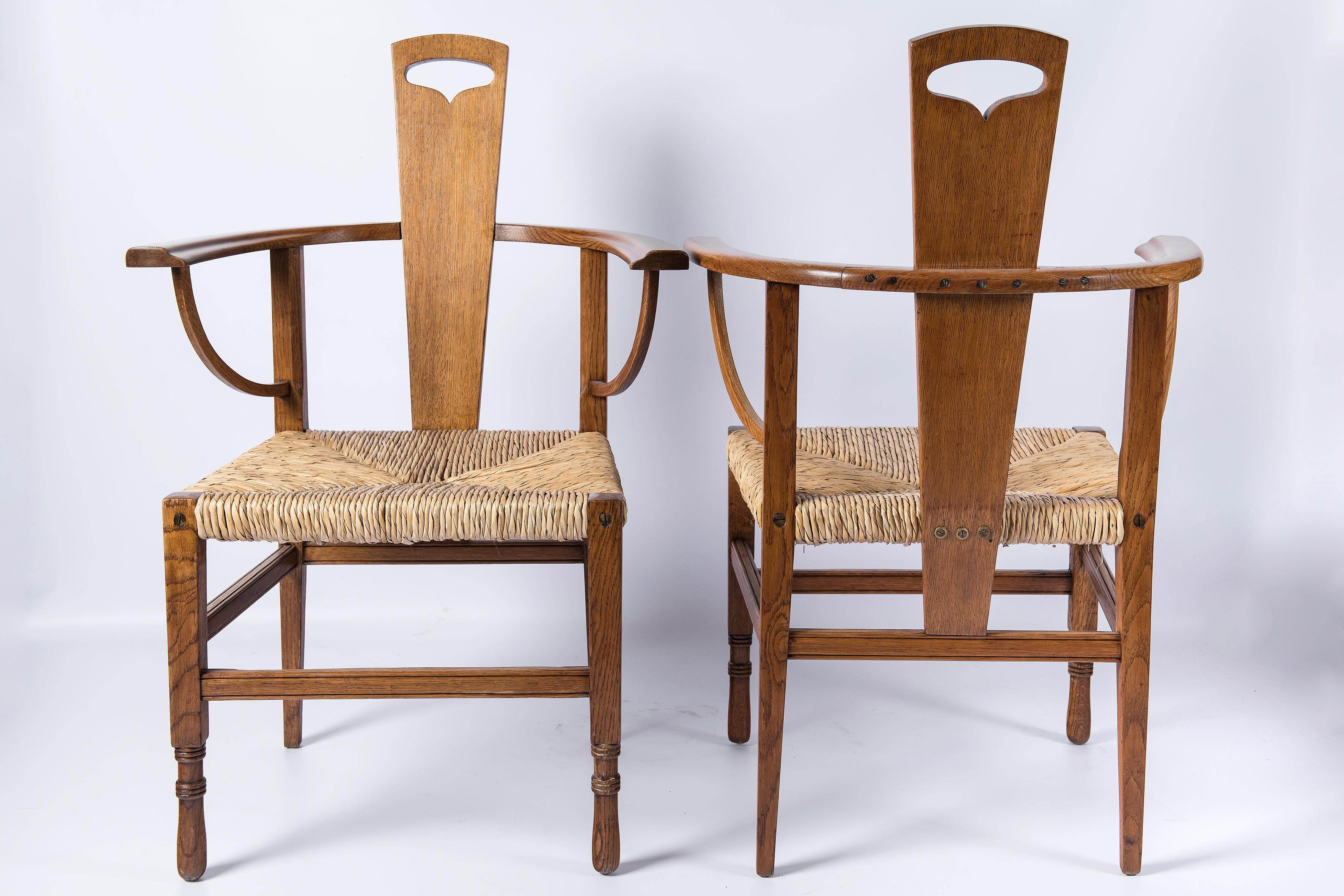 Pair of oak and rush armchairs. Attributed to George Henry Walton. Scotland, circa 1890. Glasgow school period.