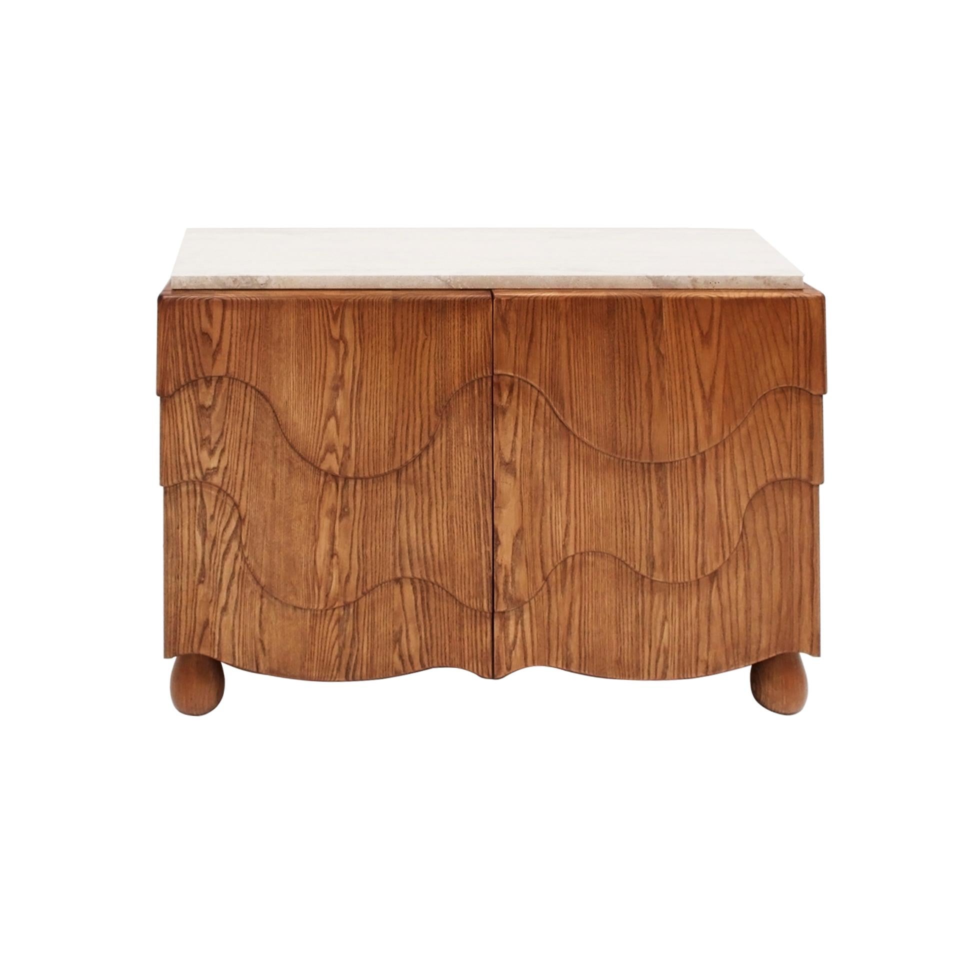 Dimensions: W 119 x D 48 x H 80 cm.

Elegant pair of contemporary sideboards handcrafted from solid oak wood, featuring a sophisticated travertine top. Each sideboard is designed with two hinged doors and an internal wooden shelf, offering both