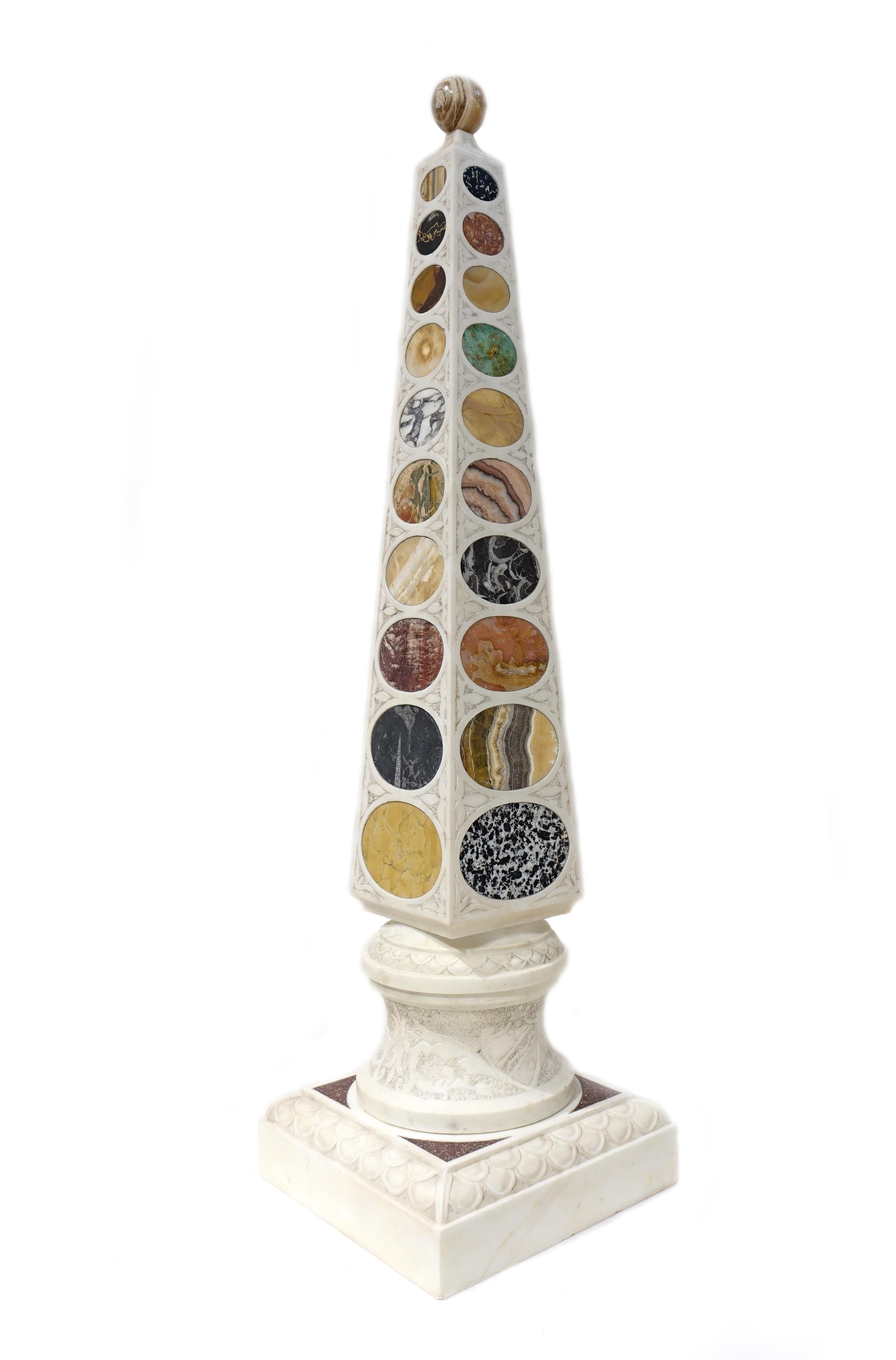 Pair of obelisks in white Carrara marble with base carved with low relief decorations and
with sampling of rare marbles on 4 sides.
The top sphere is made with flowery onyx.
The samples present different types of marble: Portoro di Portovenere,