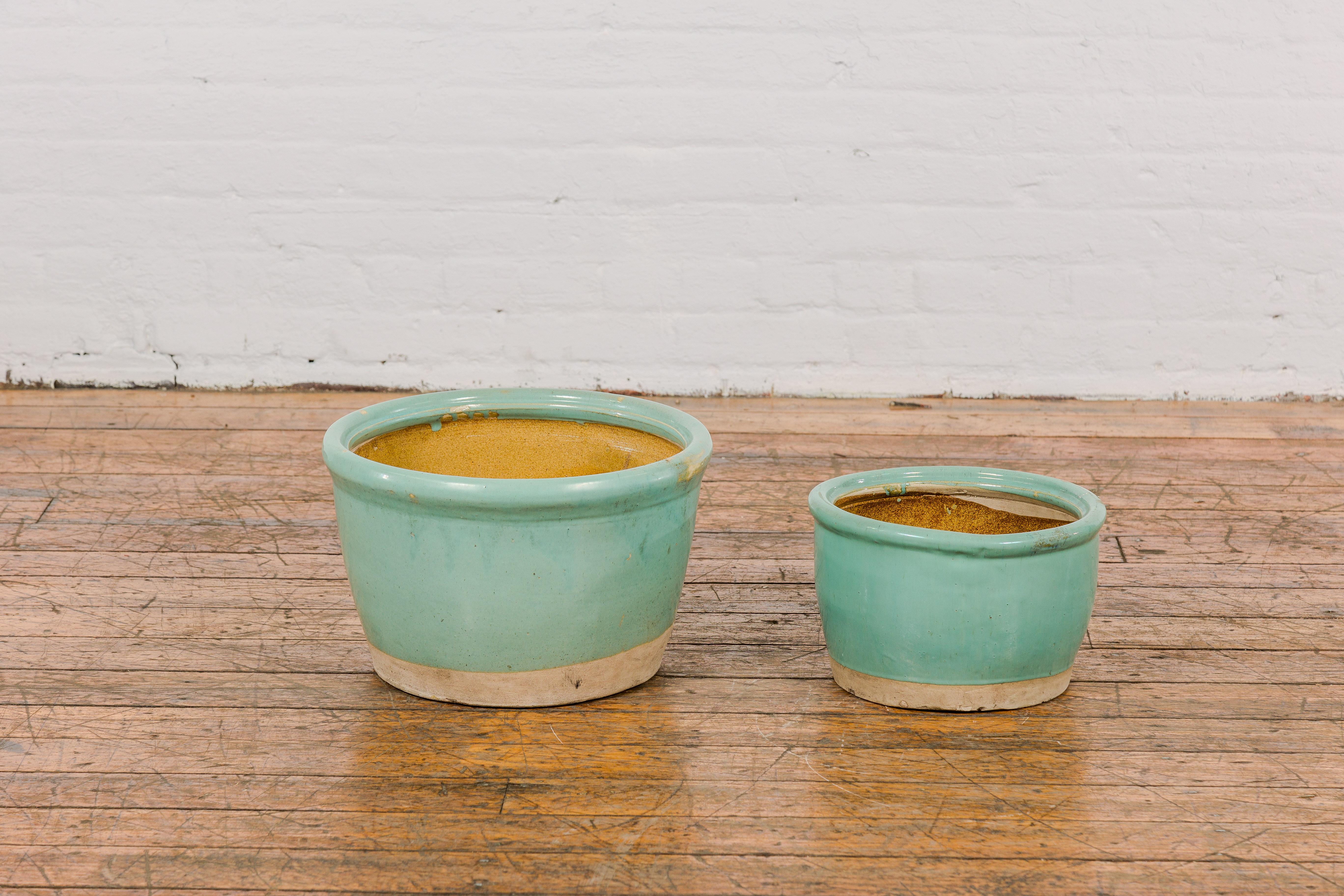 Chinese Pair of Ocean Blue Glazed Ceramic Round Nested Planters with Tapering Lines For Sale