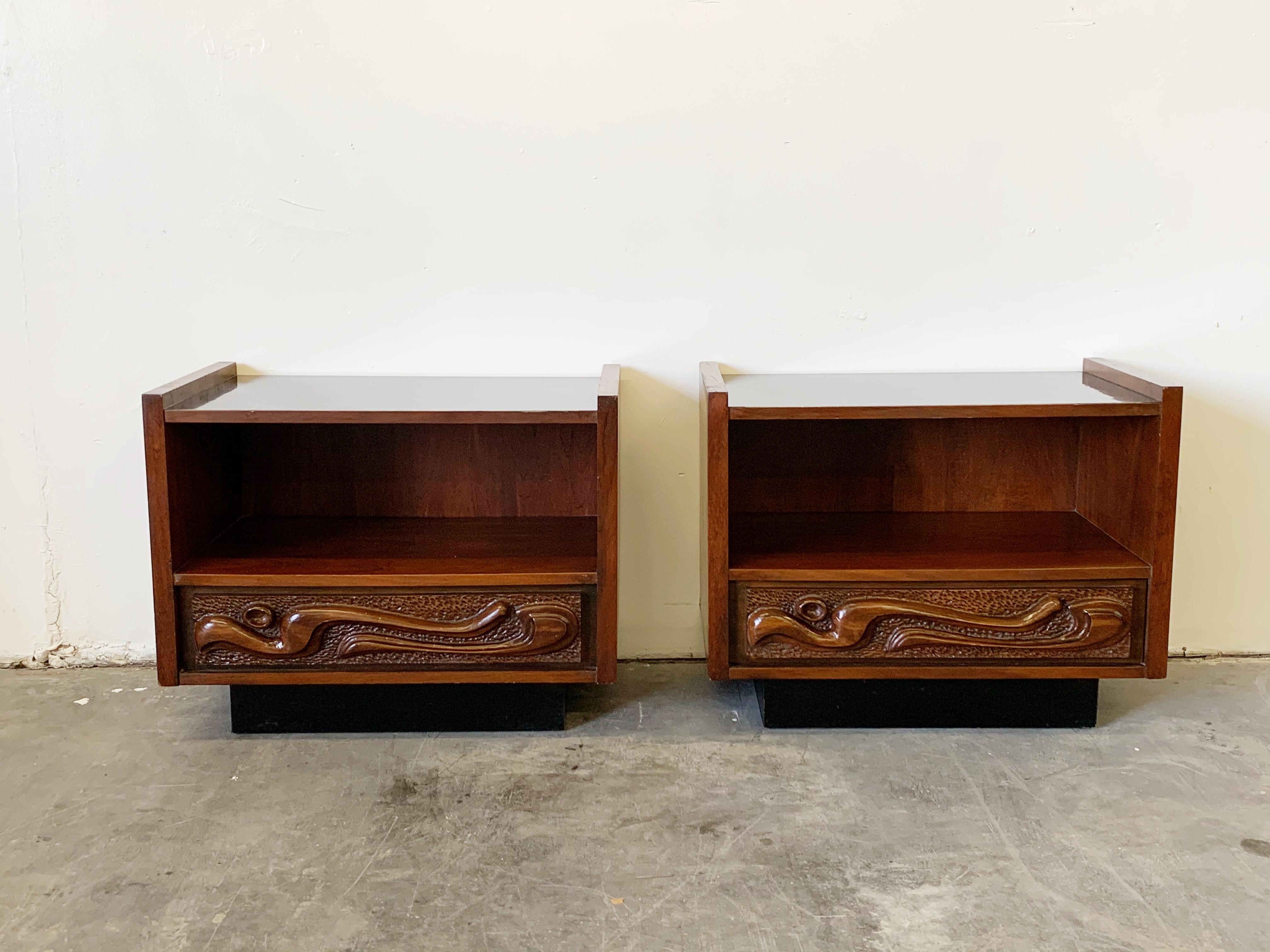 This fantastic lacquered sculpted walnut 'Oceanic' pair of nightstands are by Pulaski Furniture Corporation, circa 1969 which perfectly encapsulates the California surf mentality of the 1960s and 1970s, making this piece a highly sought after design
