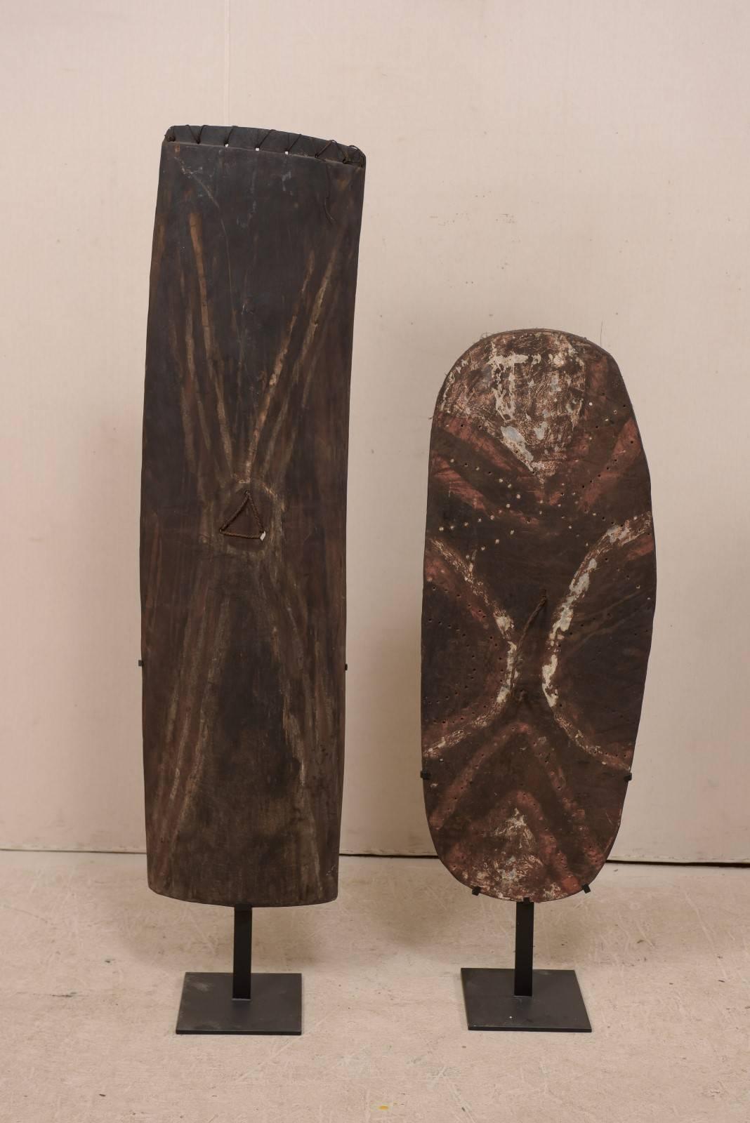 Tribal Pair of Oceanic War Shields on Stands from Papua New Guinea