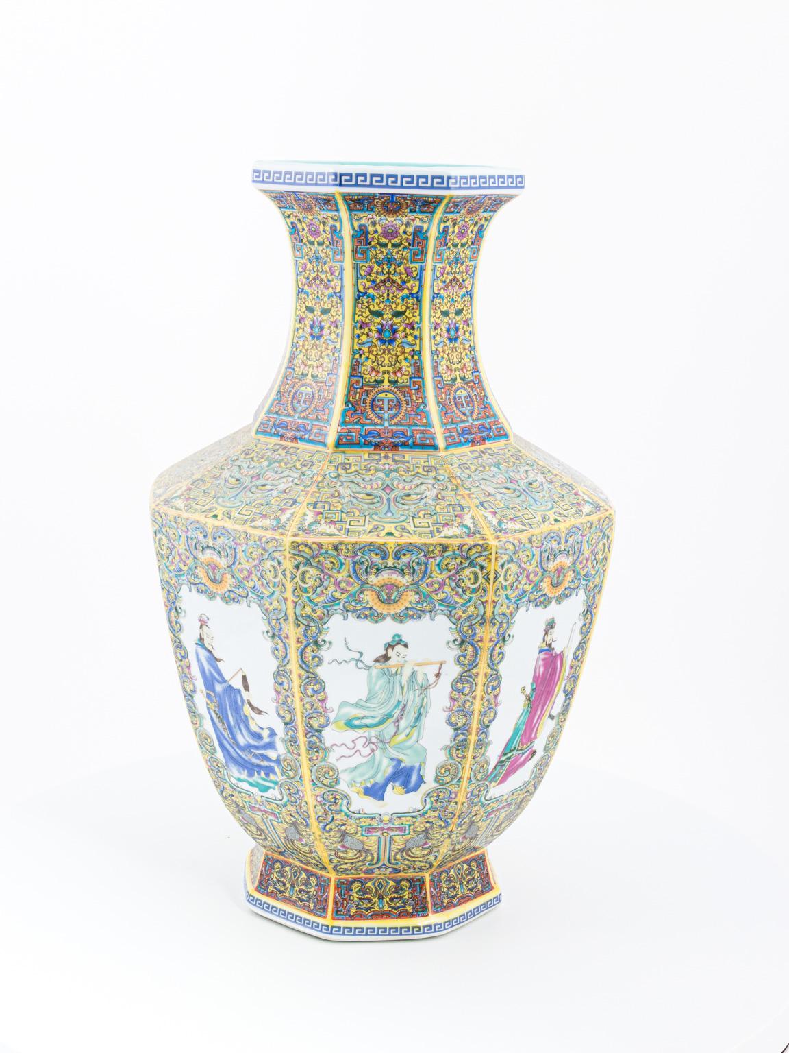Pair of multicolored Chinese vases with various traditional, hand painted figures both female and male, circa 20th century. Please note of minor paint loss due to wear with age.
  