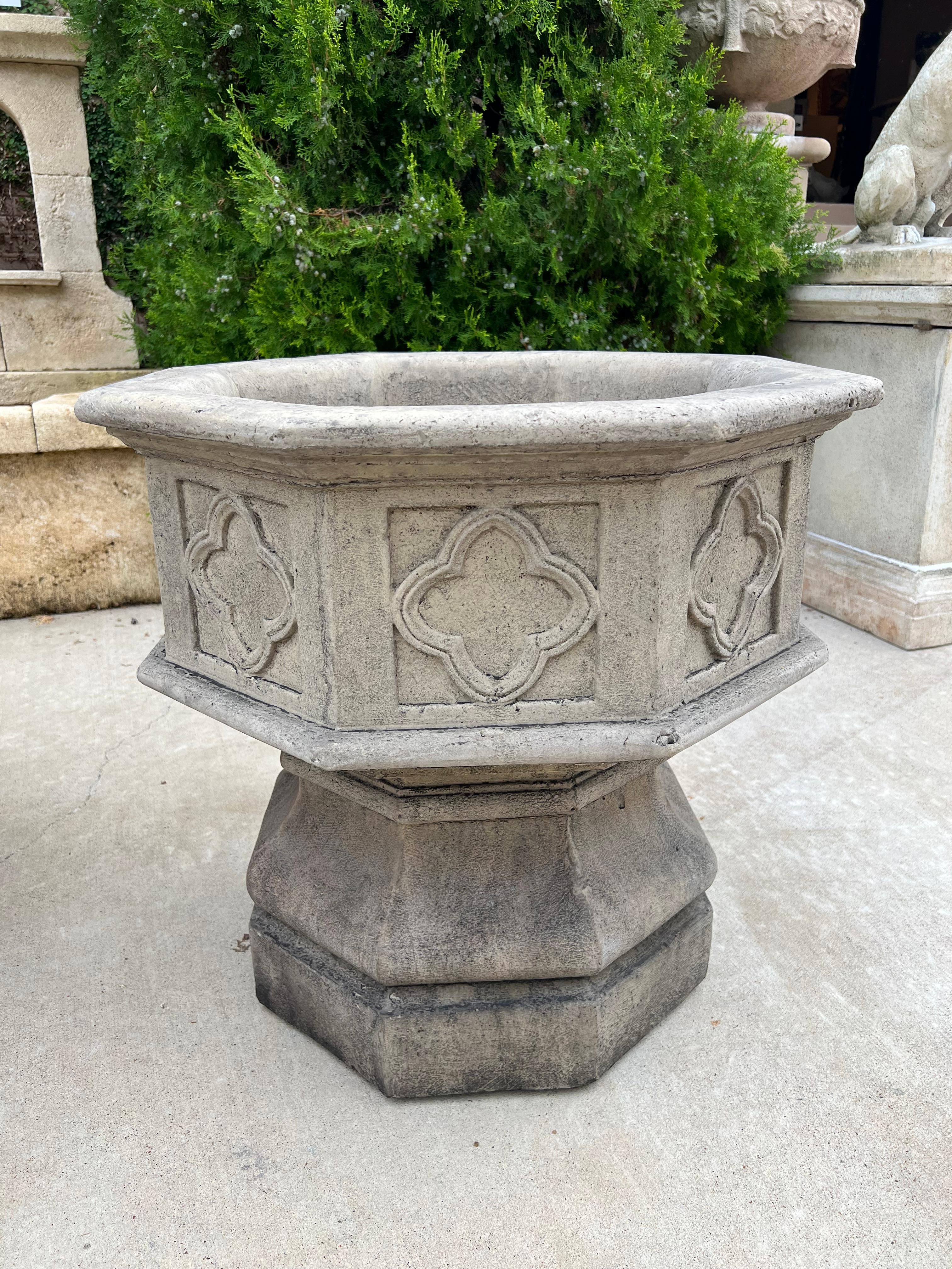 One hallmark of Gothic architecture was the abundant use of tracery, or geometric latticework in structural designs. Perhaps one of the most readily recognized forms of tracery is the quatrefoil, seen on the side of this pair of octagonal cast