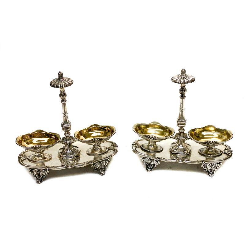 Pair of Odiot Paris French silver gilt footed open salt cellars, 19th Century

An exquisite pair of Odiot Paris French silver handled footed open salt cellars, 19th century. Foliate leaf accents to the feet and around the rim of the base. Gilt to