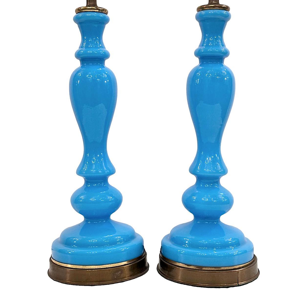 Pair of circa 1920's French blue opaline glass table lamps.

Measurements:
Height of body: 14