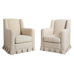 Paire de fauteuils à franges blanc cassé, années 1940