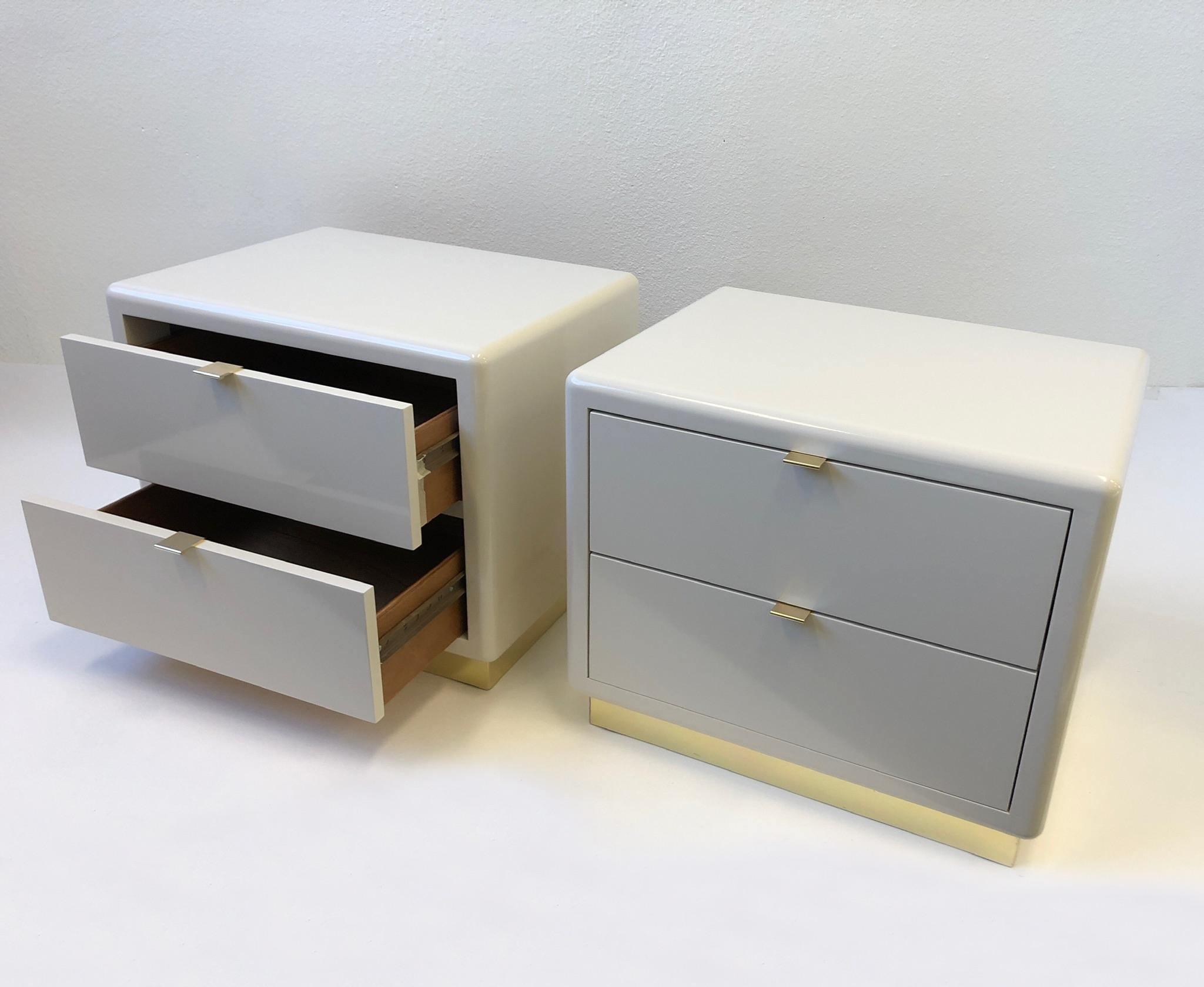 Pair of off White Lacquered and Brass Nightstands by Steve Chase 1