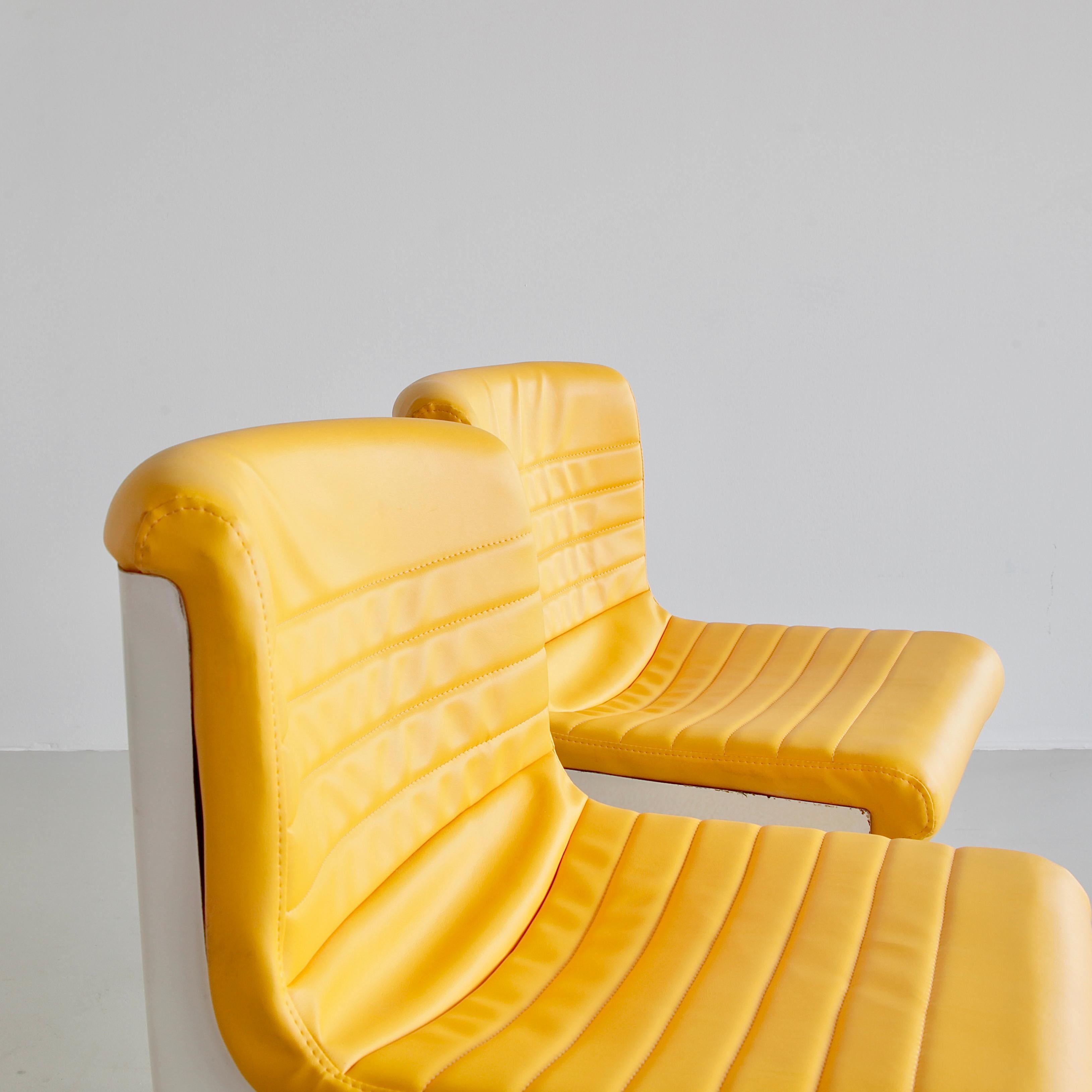 Pair of office chairs designed by Ettore Sottsass and Hans Von Klier. Italy, Design Centre (Poltronova), 1969.

An original set of the 'PROGRESS' swivel chairs, height-adjustable. Original yellow leatherette upholstery, frame in cast aluminium with