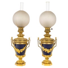Pair of Oil Lamps, Gilt Bronze and Sèvres Blue Porcelain, 19th Century.