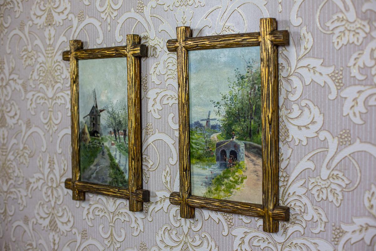 We present you a pair of oil paintings on canvas depicting the landscape of a Dutch village.

The signature is unidentified.

These pieces of art are closed in a curious frame imitating raw, wooden sticks painted gold.