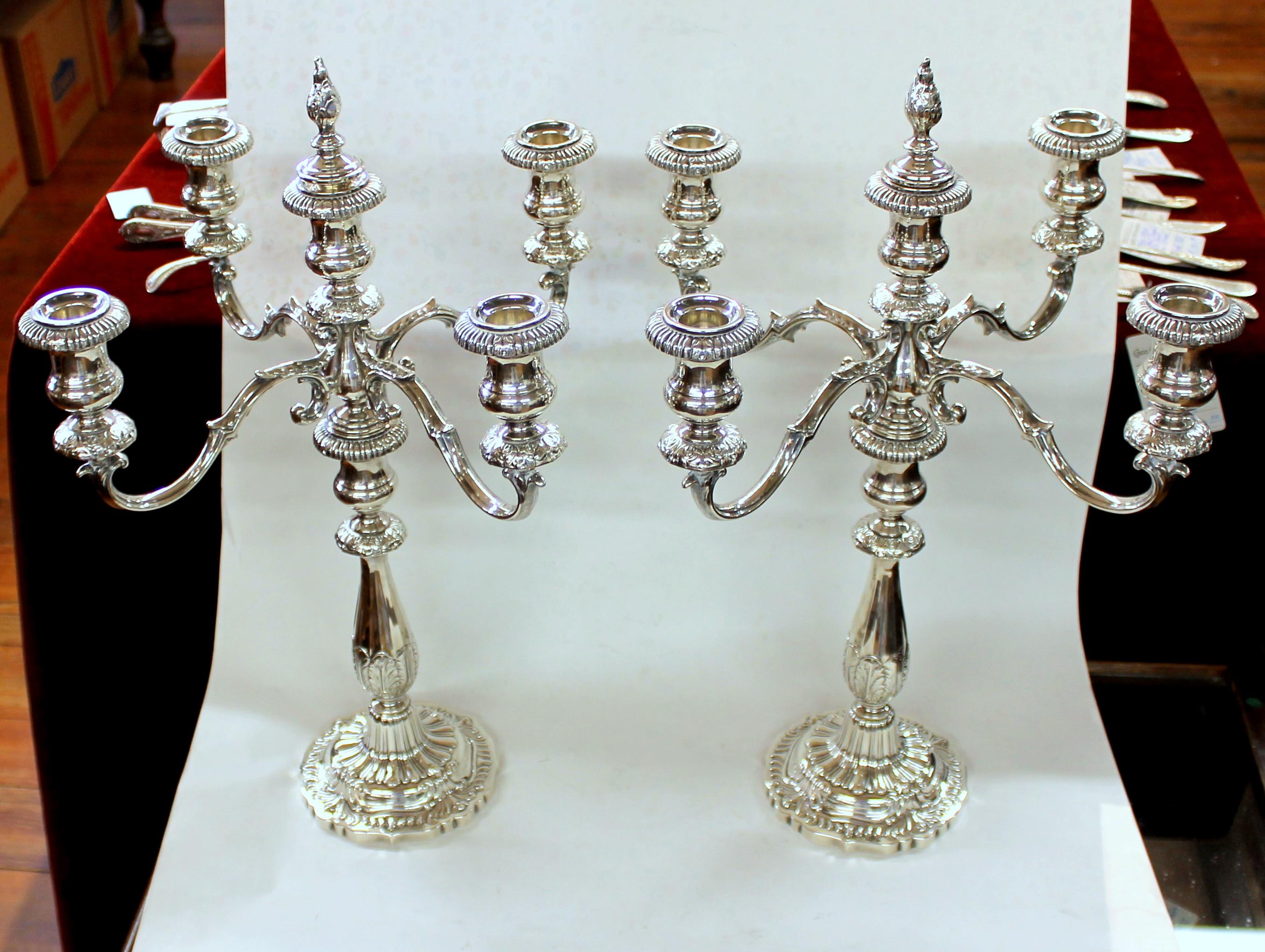 Pair of extraordinary quality Old American sterling silver five-light candelabra; please note details in the design. 

Made by Fisher Silversmiths, Jersey City, NJ
(weighted bases)

Measures: 19 1/2