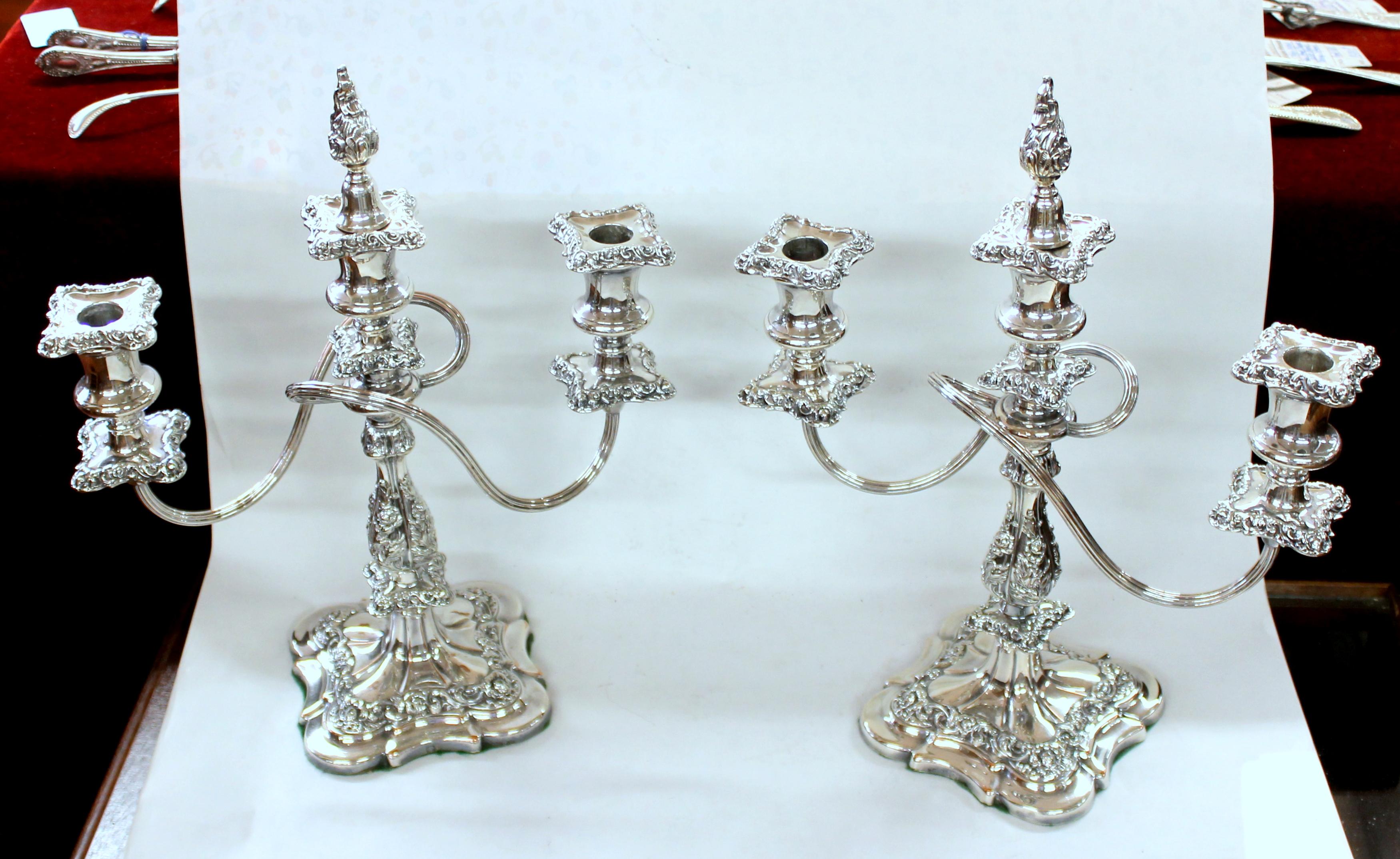 Pair of finest quality Old English Ellis silver plate Rococo style three-light candelabra with flame snuffer

Maker- Ellis Silver Co., Birmingham (predecessors to Ellis-Barker Silver Co.)
5 1/2