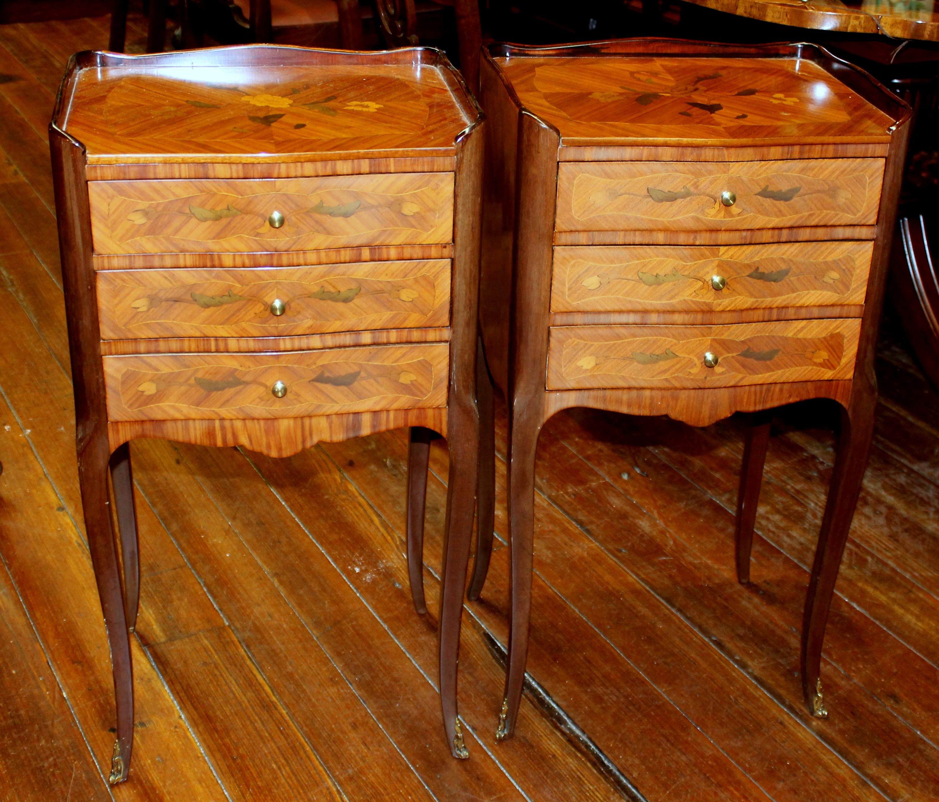 Fine pair of old French Louis XV style marquetry inlaid kingwood bedside tables; three drawers each table and top gallery. Some very slight dings noted and illustrated.
