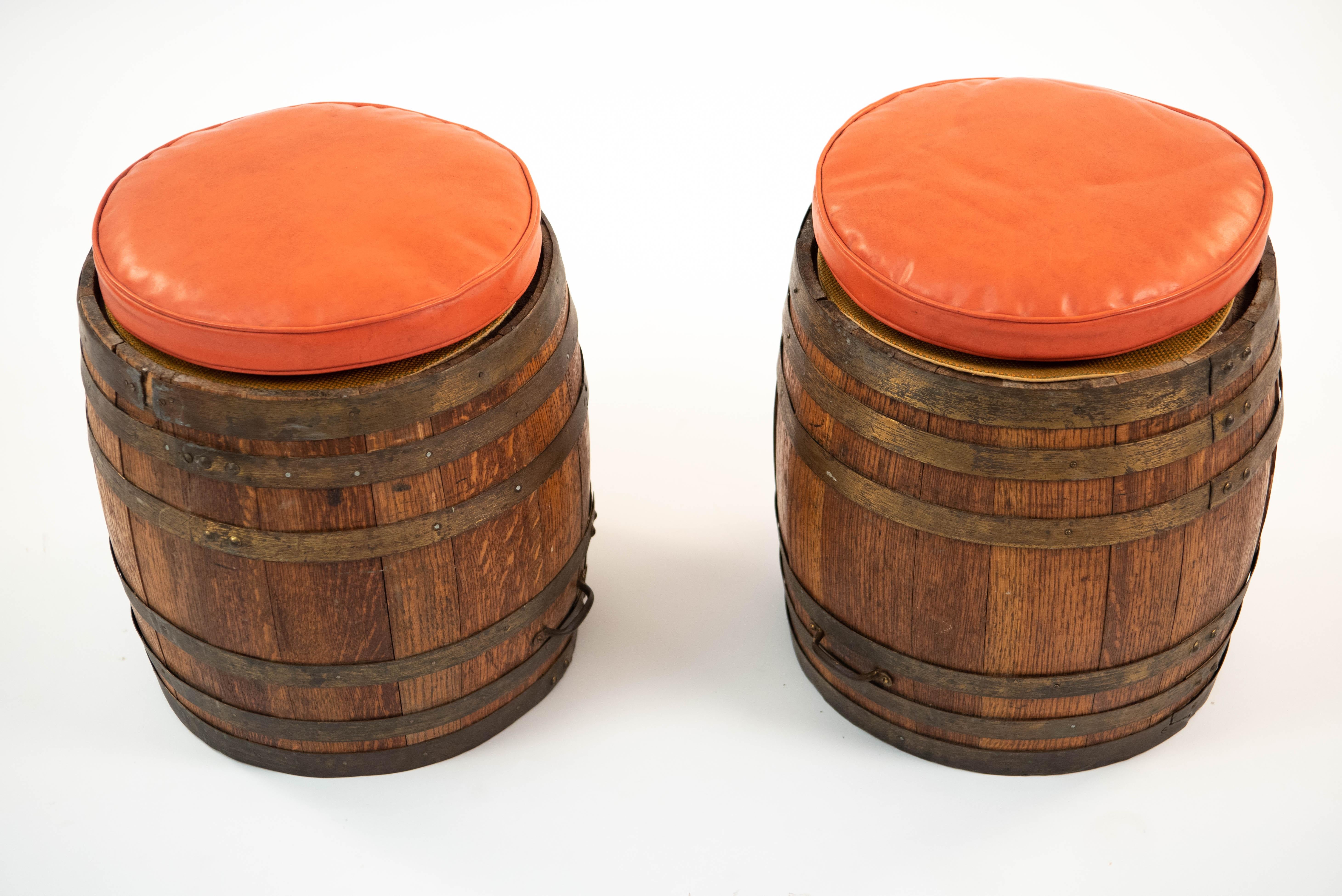 This charming pair of barrel shaped stools brings a rustic element to an interior. By Old Hickory Furniture Company. Label under seat cushion.