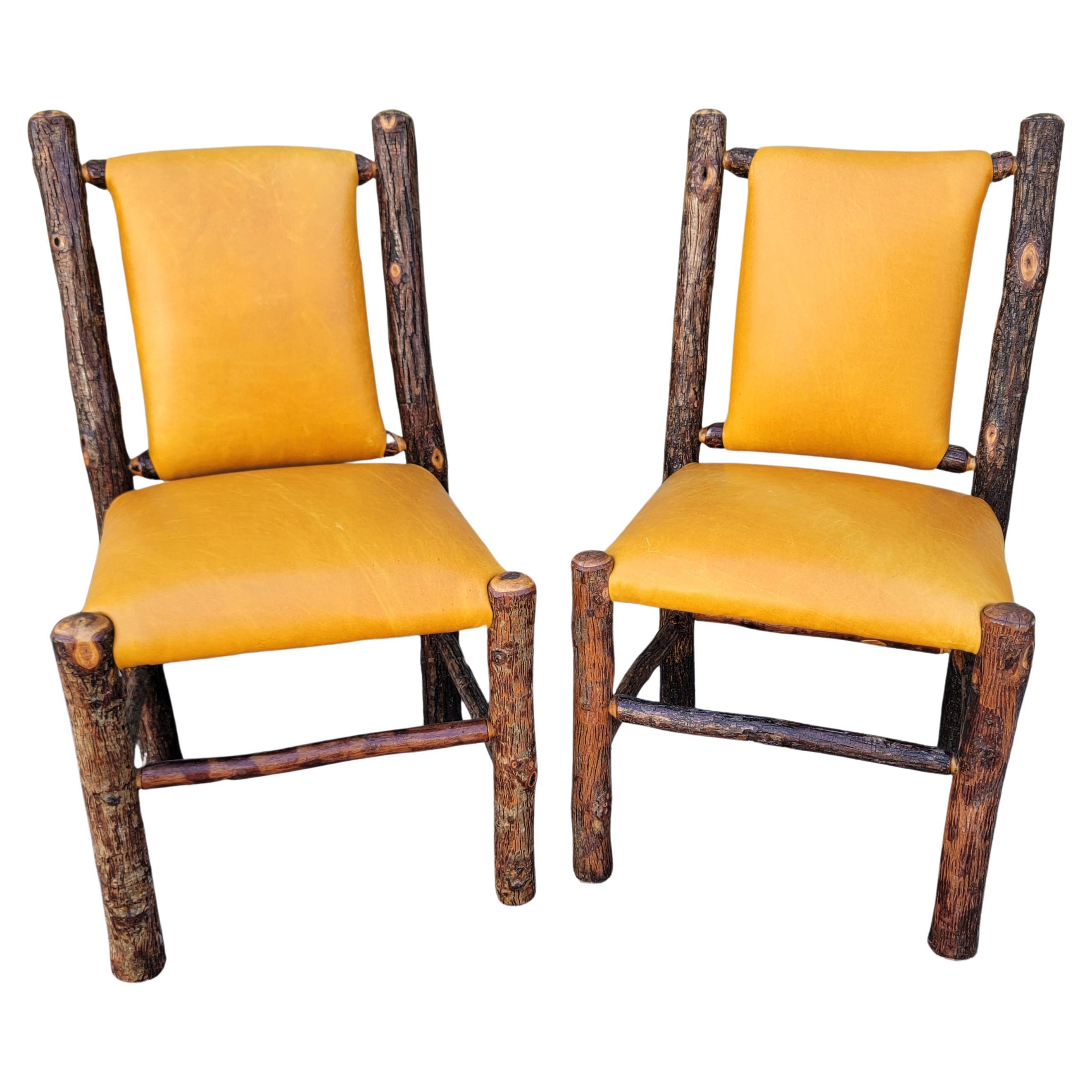Pair of Old Hickory Leather Covered Chairs