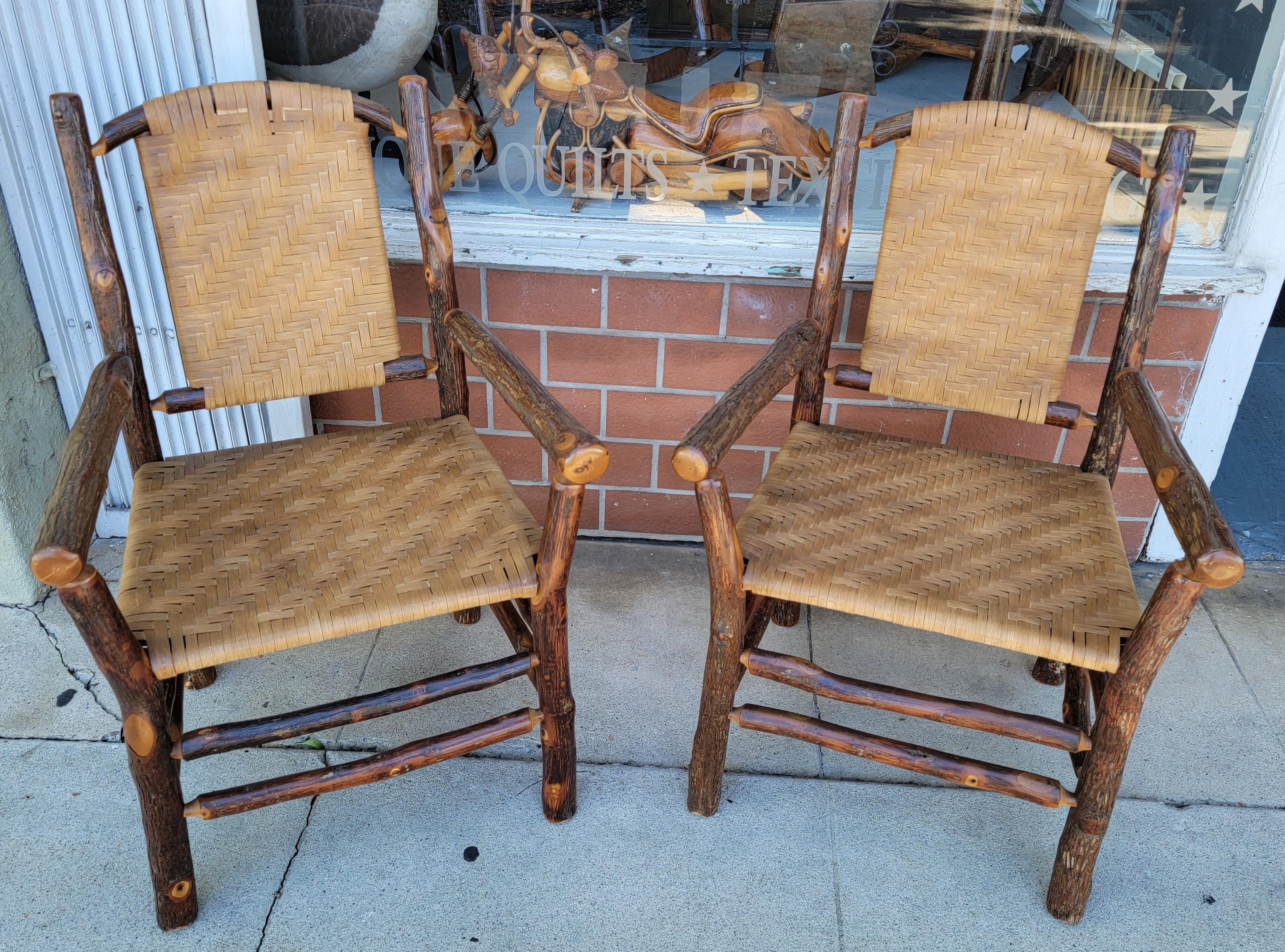 Pair of old hickory chairs w/ rush back and seat.