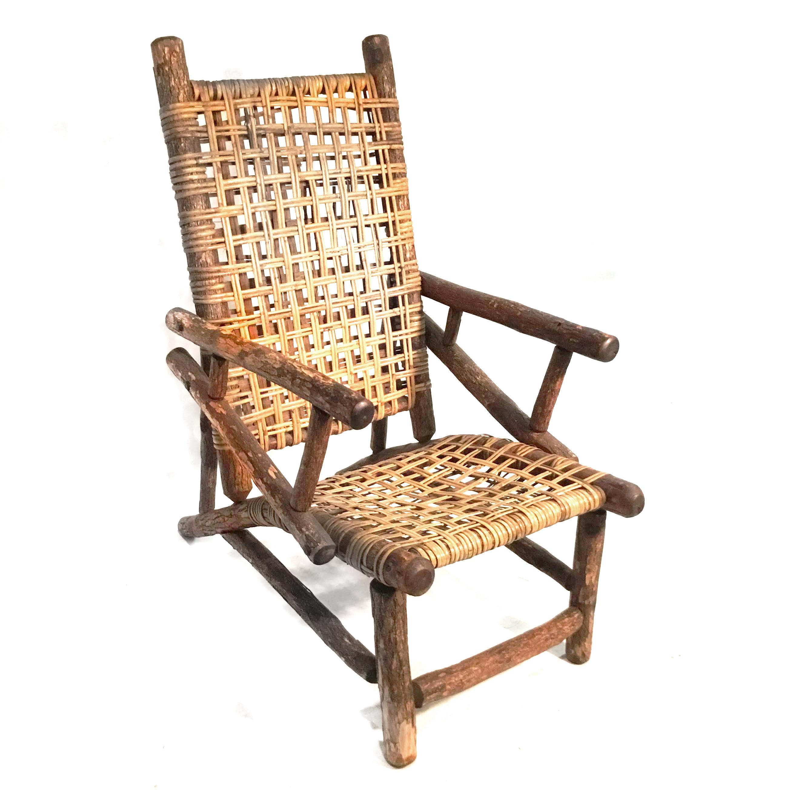 Pair of Old Hickory style chairs with wooden frames and rattan seats
