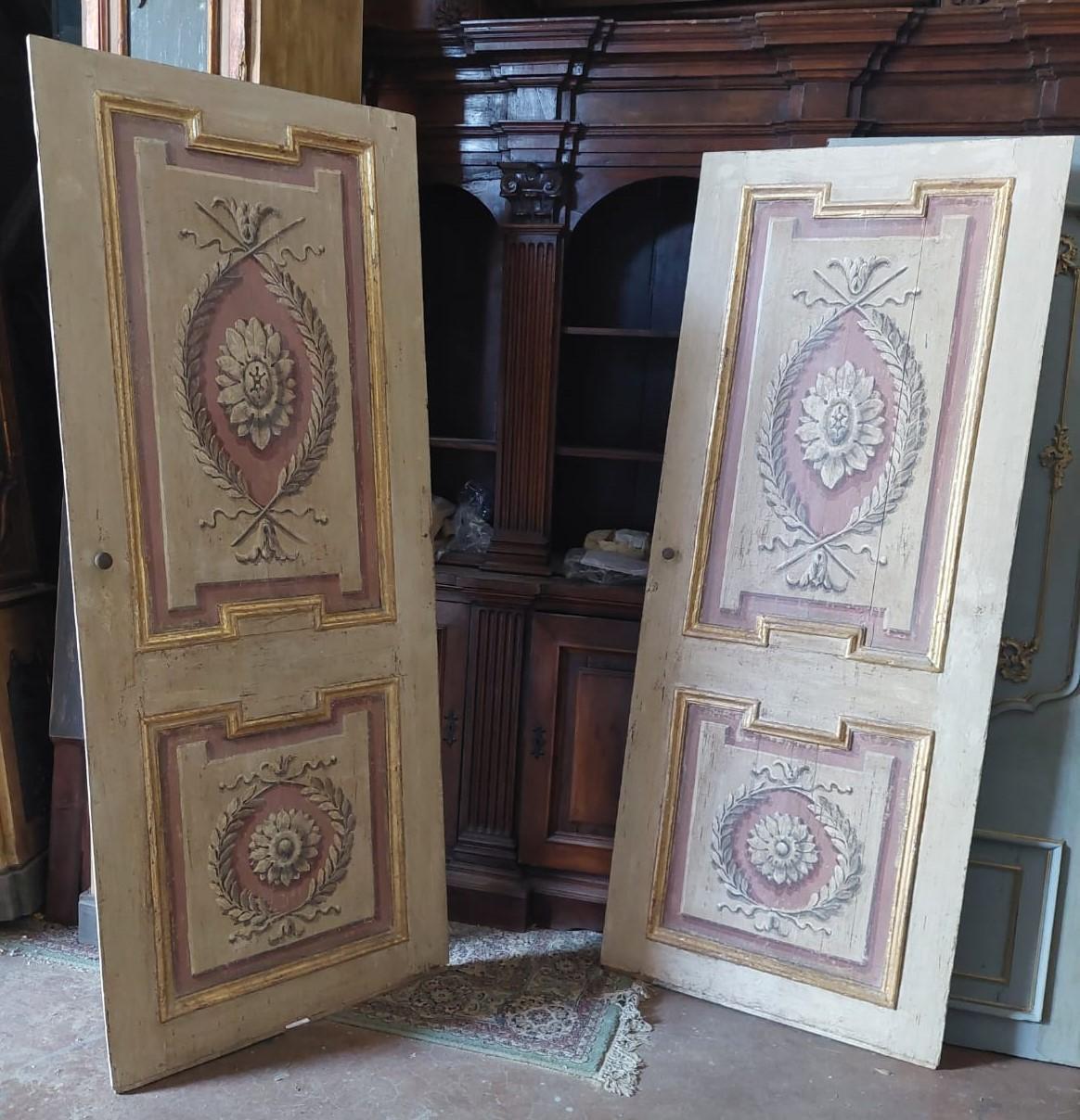 Pair of antique doors painted by hand, lacquered and gilded, built in solid poplar wood, wonderful in pairs, built for a noble palace in Florence (Italy) in the middle of the 18th century.
Finished on both sides, very precious between unique