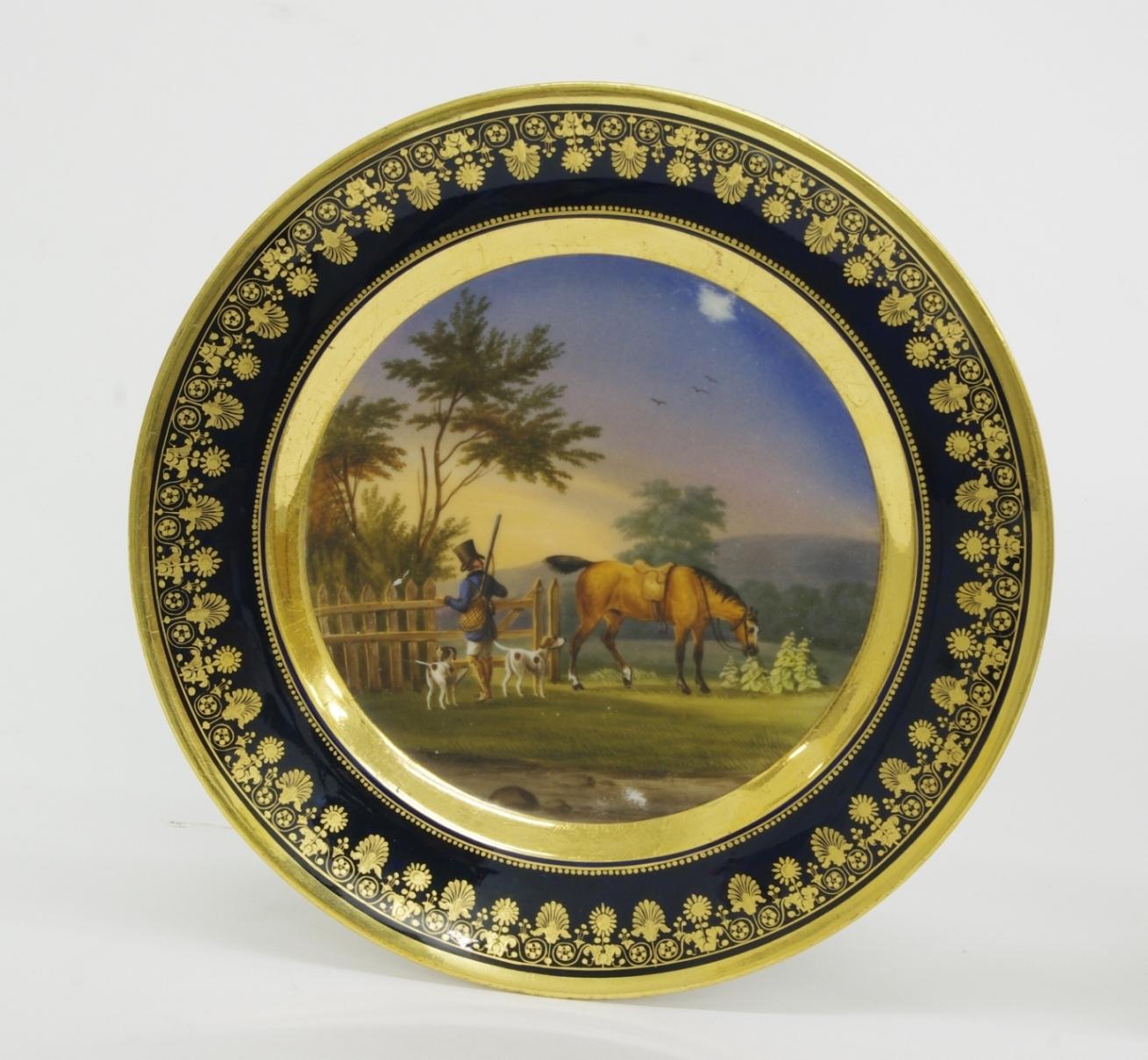 Fine pair of old pairs porcelain cabinet plates, each painted with an equestrian hunt scene within a wide gold band; the cobalt border well gilded with neoclassical motifs of anthemions and flowers. Signed in black, Schoelcher.

Marc Schoelcher