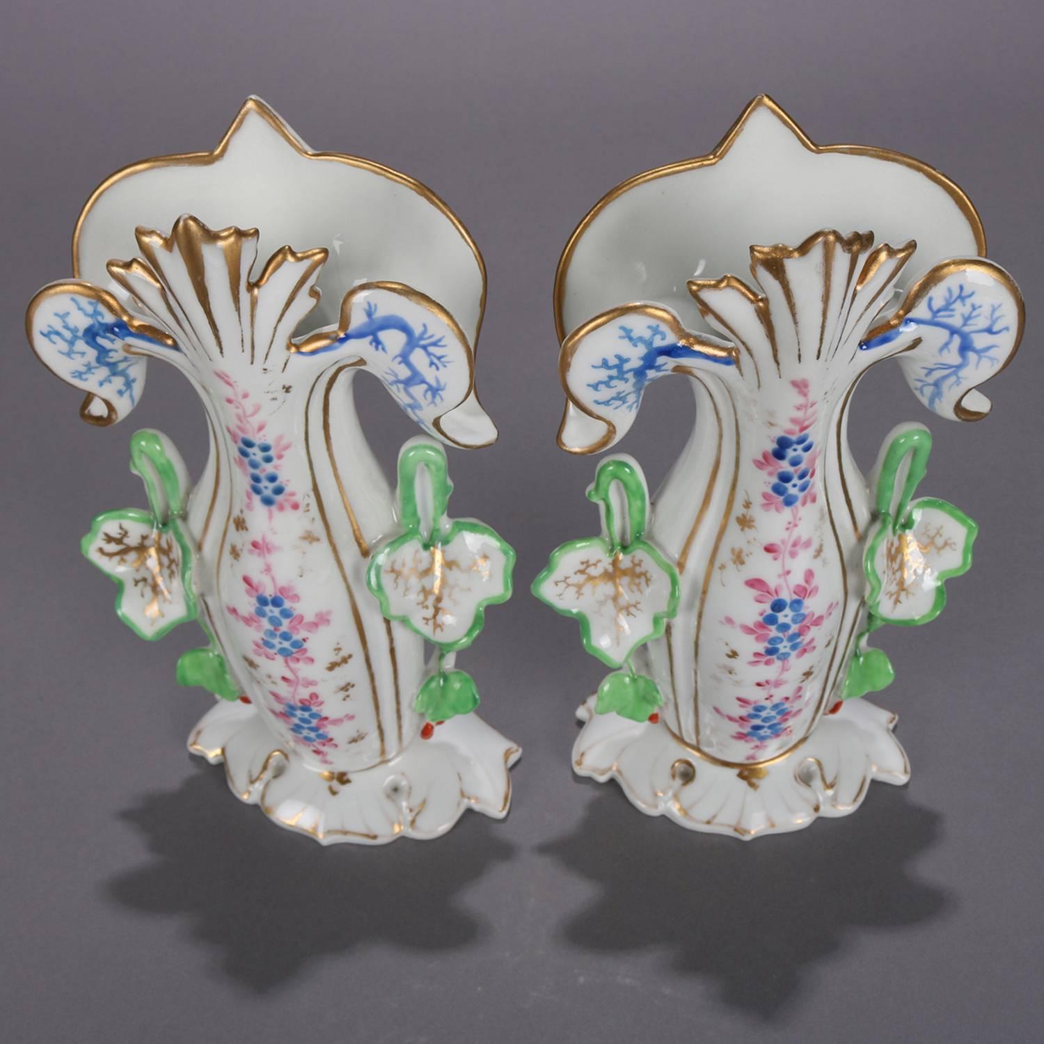 Antique pair of French Old Paris hand-painted porcelain spill vases feature floral form with floral and gilt decoration, circa 1870.

Measure: 9.25