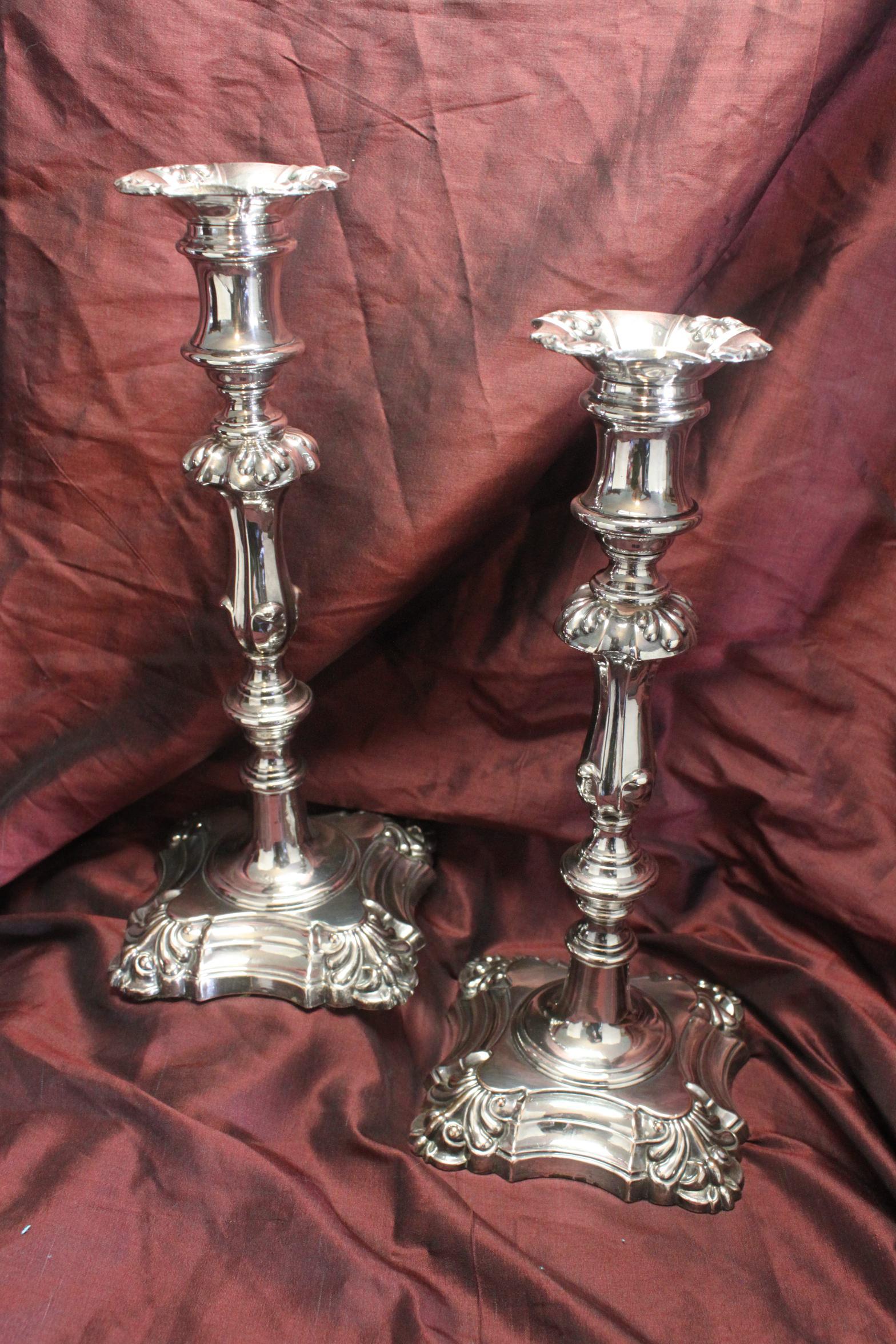 This very attractive pair of Old Sheffield plate candlesticks were made in Sheffield by the firm of Henry Wilkinson & Co. They stand 290 mm (11.5 inches) high, on a 124 mm (5 inch) base, and are in very good condition, with only minimal wear to the