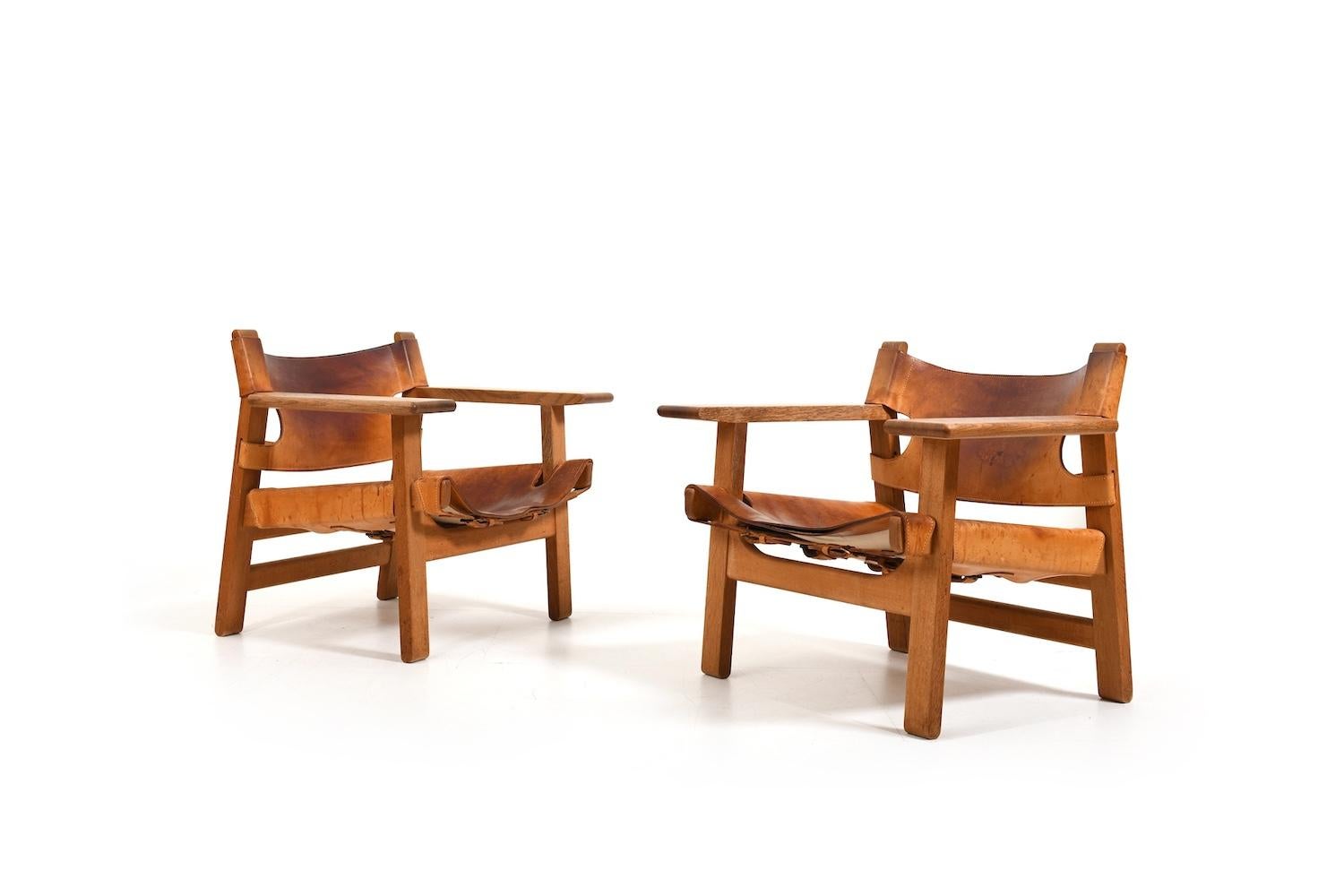 Beautiful old pair of Børge Mogensen’s spanish chair. Designed 1958 for Fredericia Stolefabrik Denmark. Model BM2226. Old edition. Made in solid oak and natural leather. Produced early 1960s. We decided not to do anything to these chairs. That's how